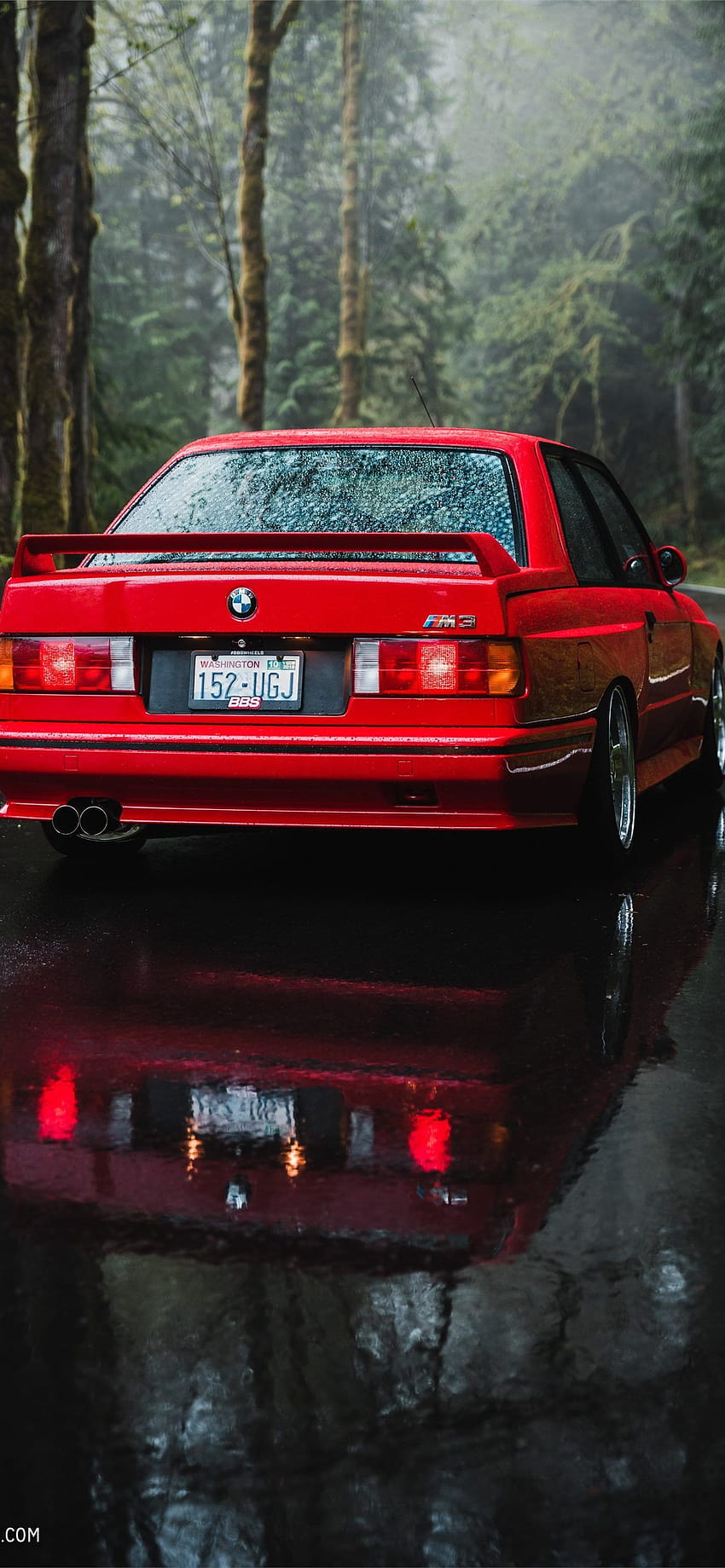A red car parked in the rain - BMW