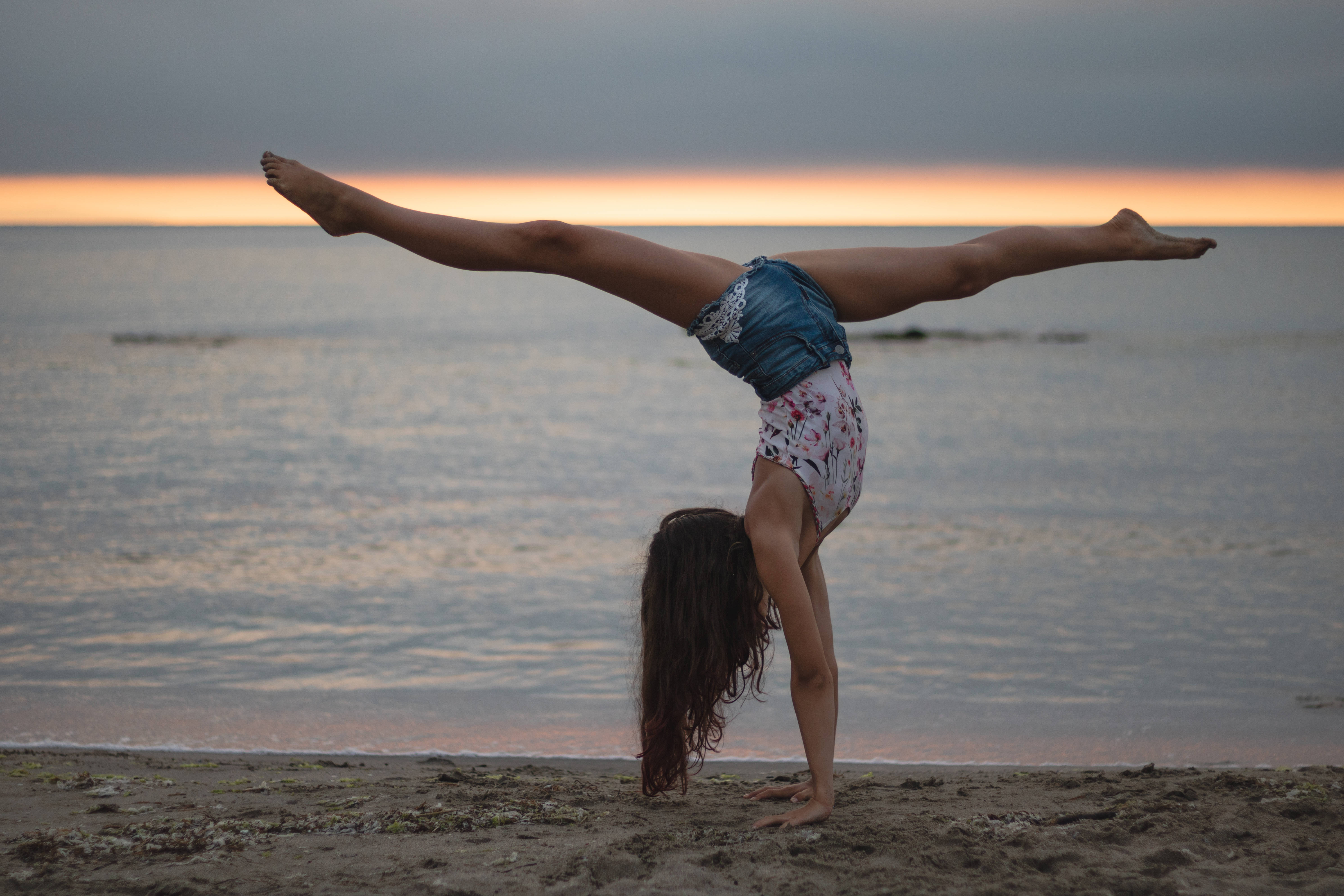 Download Gymnastics Seashore Sunset Wallpaper