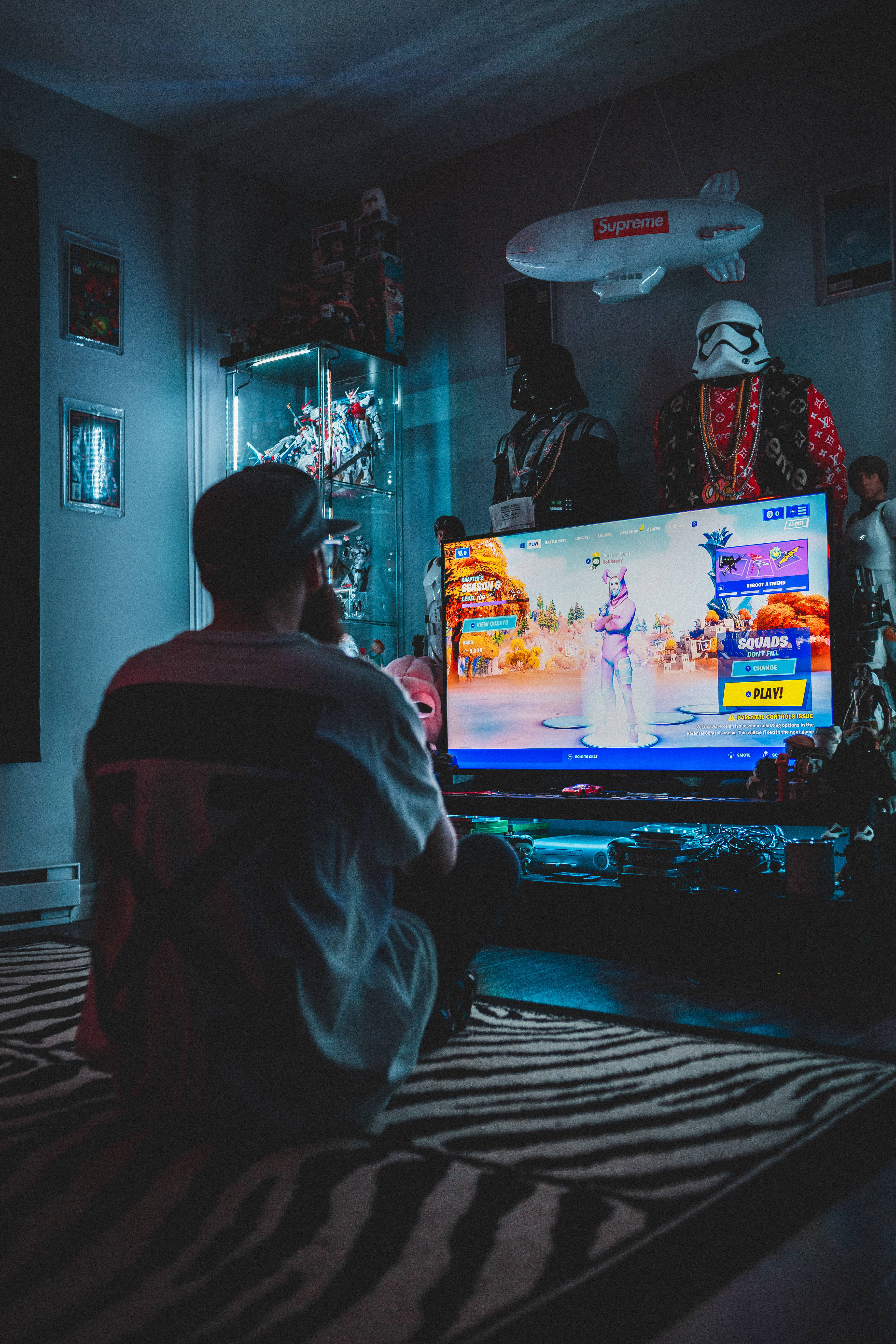 A man sitting in front of the television - Gaming, Fortnite