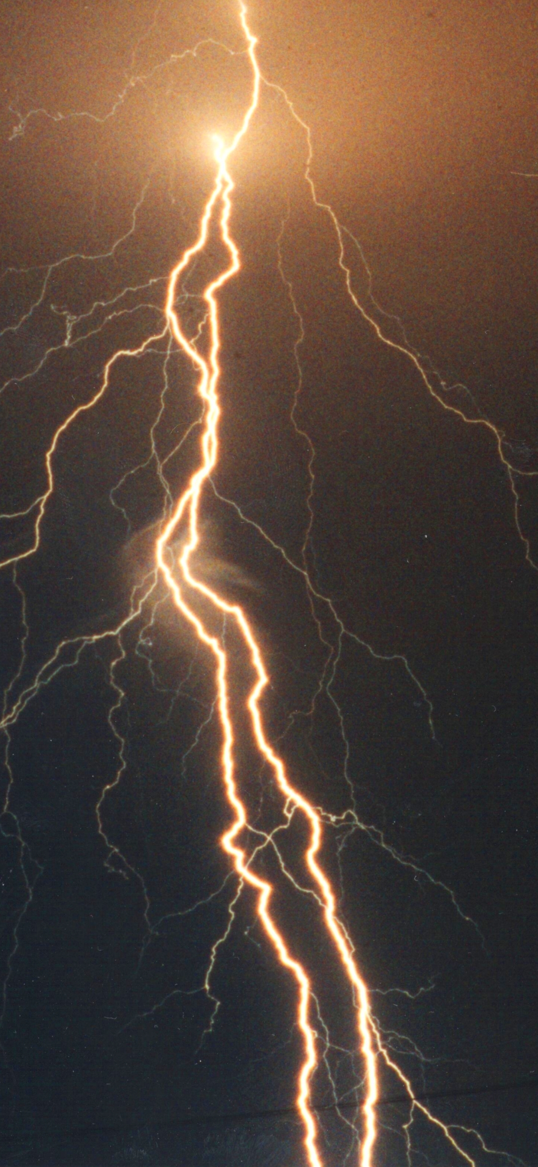 A lightning bolt is seen in the sky - Lightning