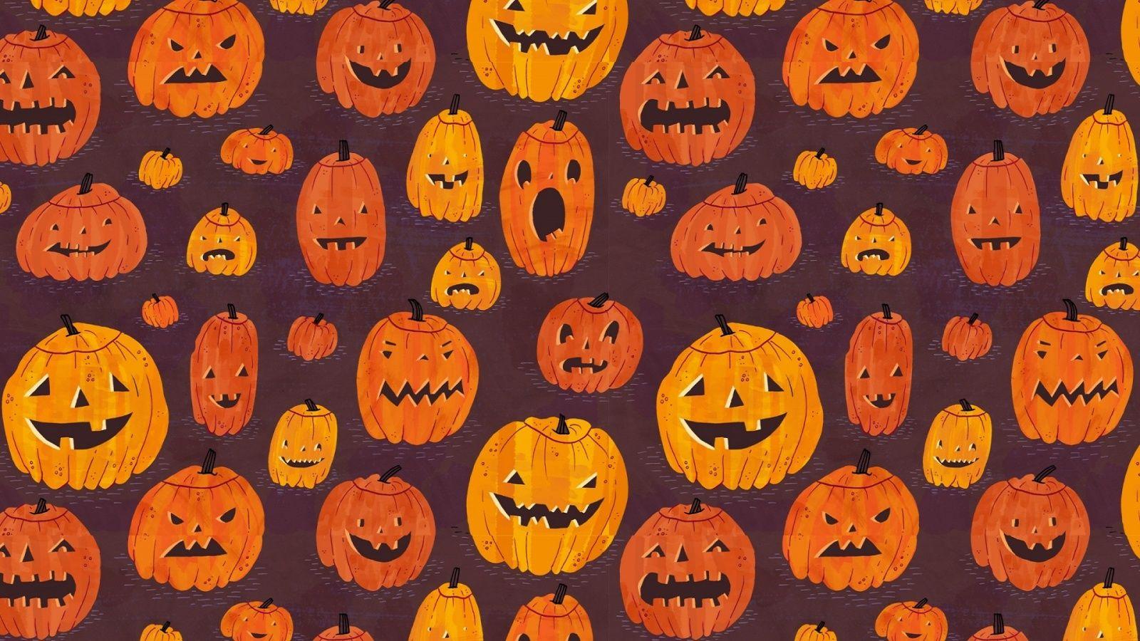 Halloween wallpaper with pumpkins on a dark purple background - Spooky