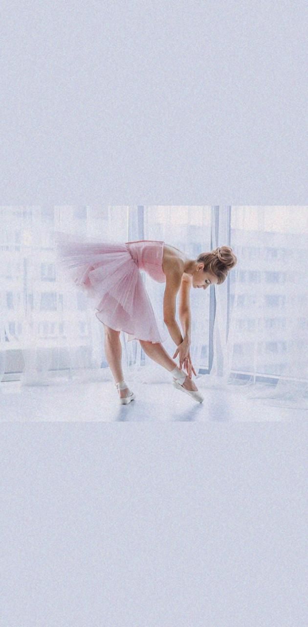 A woman in pink ballet outfit is doing some sort of dance - Ballet, dance