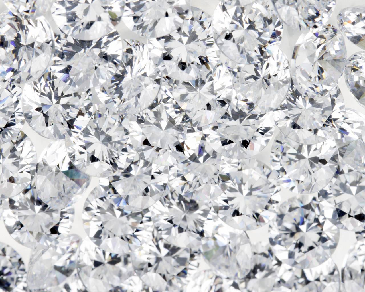 A close up of diamonds on the ground - Diamond