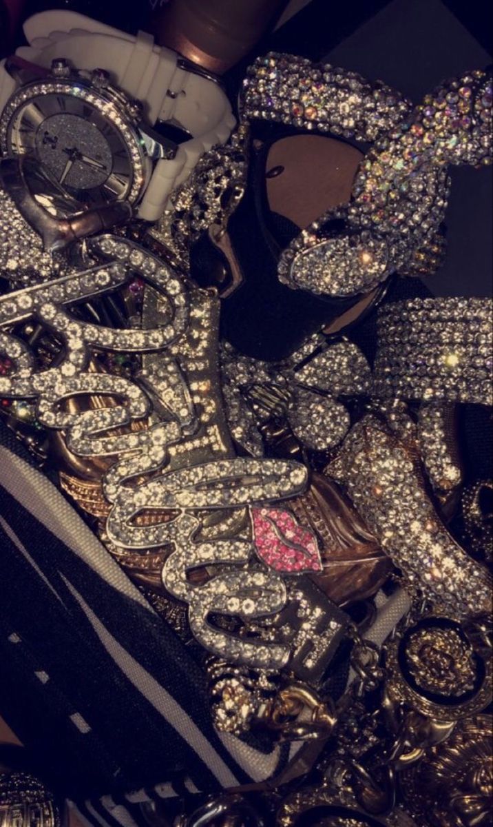 A bunch of jewelry and watches on display - Bling