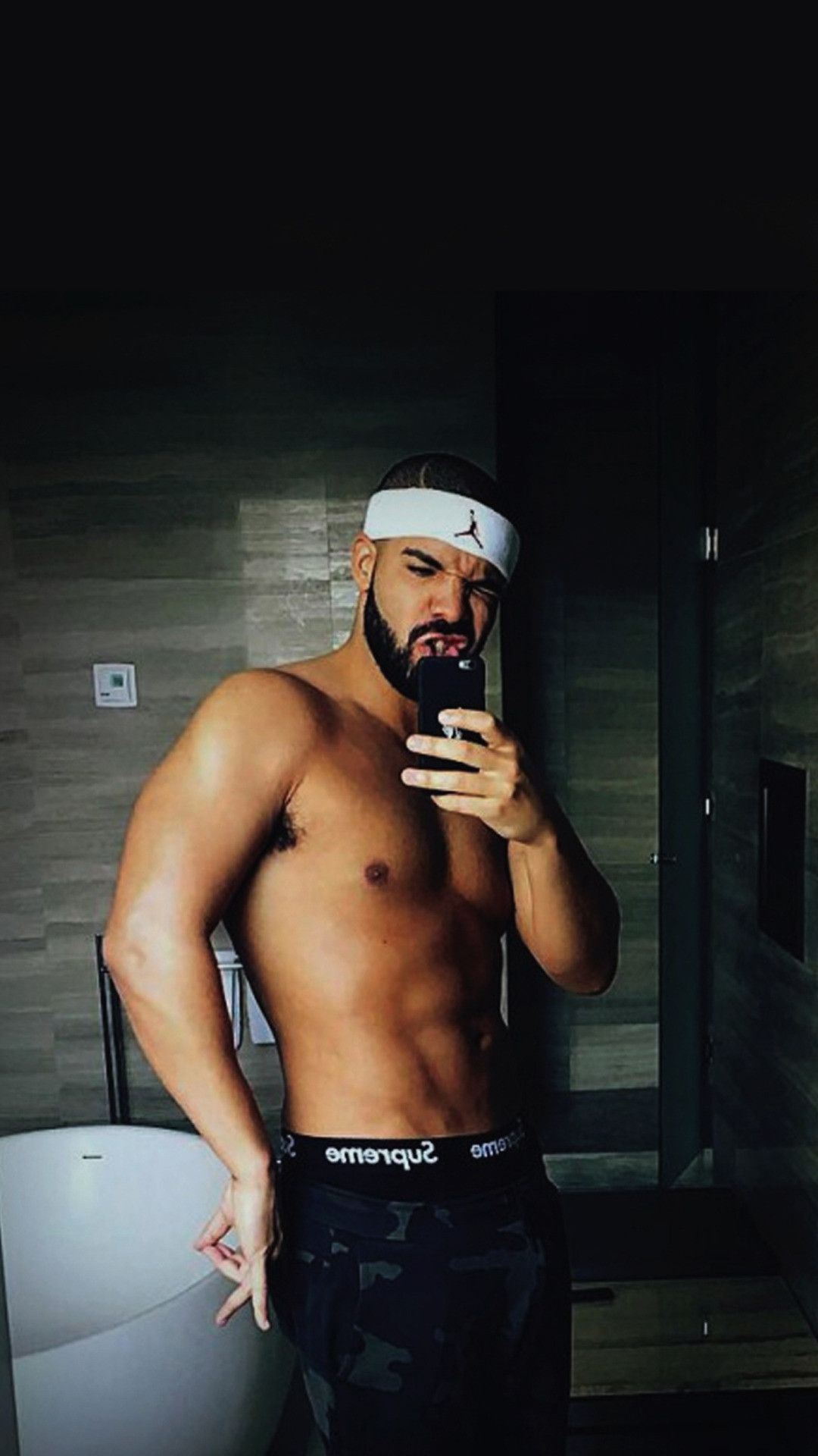 A man taking selfie in bathroom - Drake