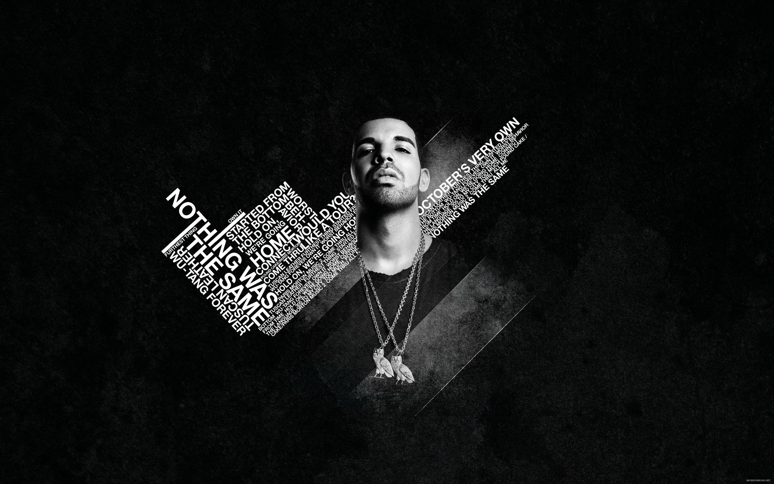 The wallpaper is a black and white photo of an artist - Drake