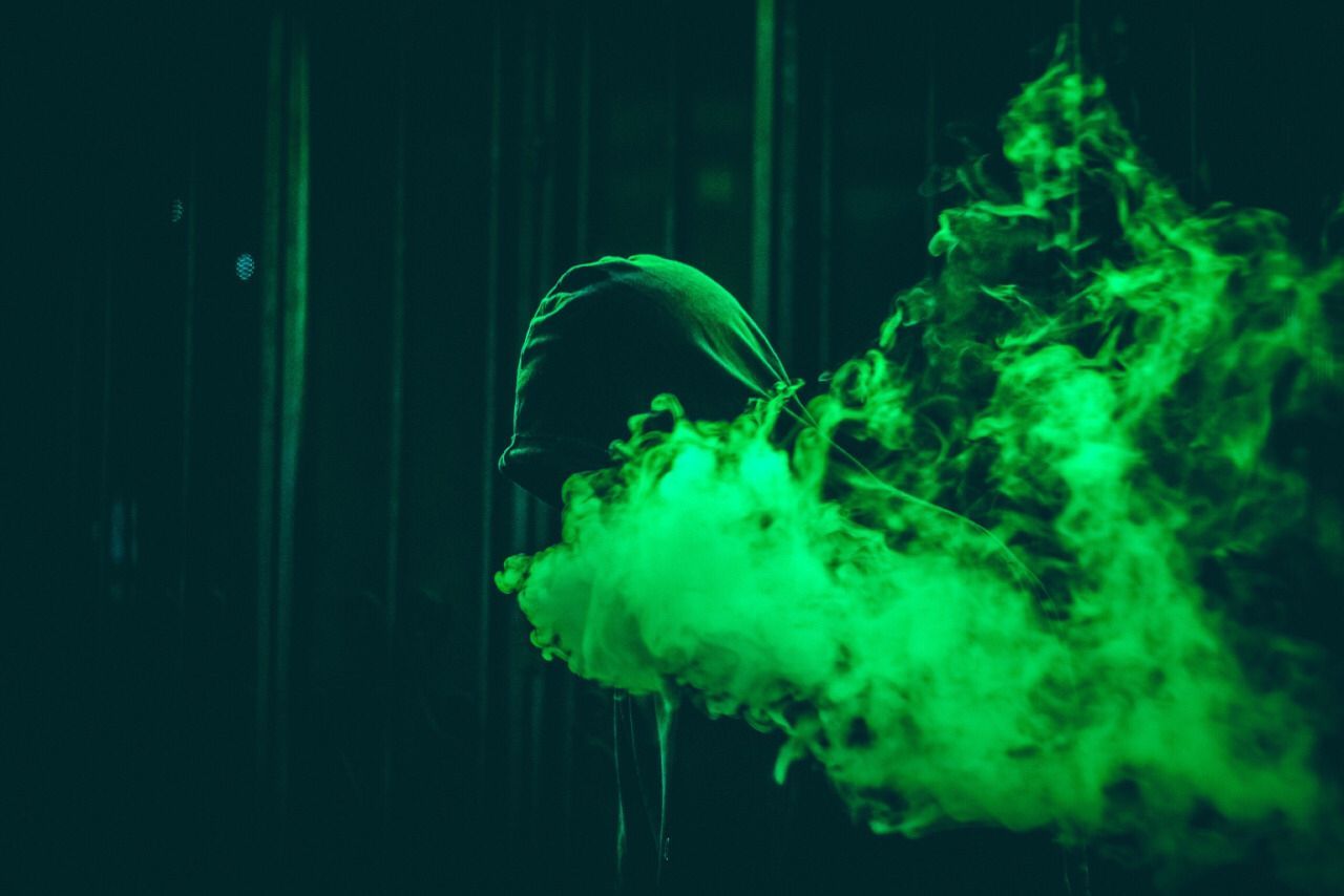 A person in hoodie with smoke coming out of it - Pop Smoke