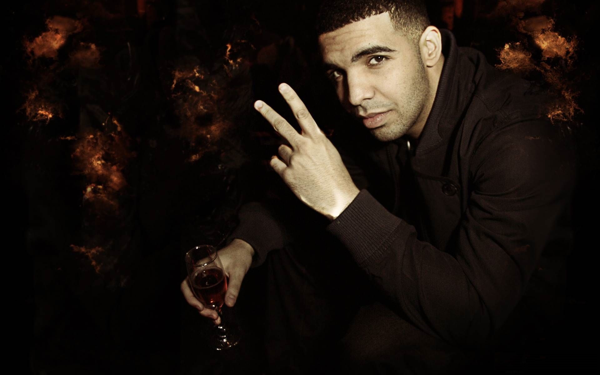 Rapper Drake holding a glass of alcohol - Drake