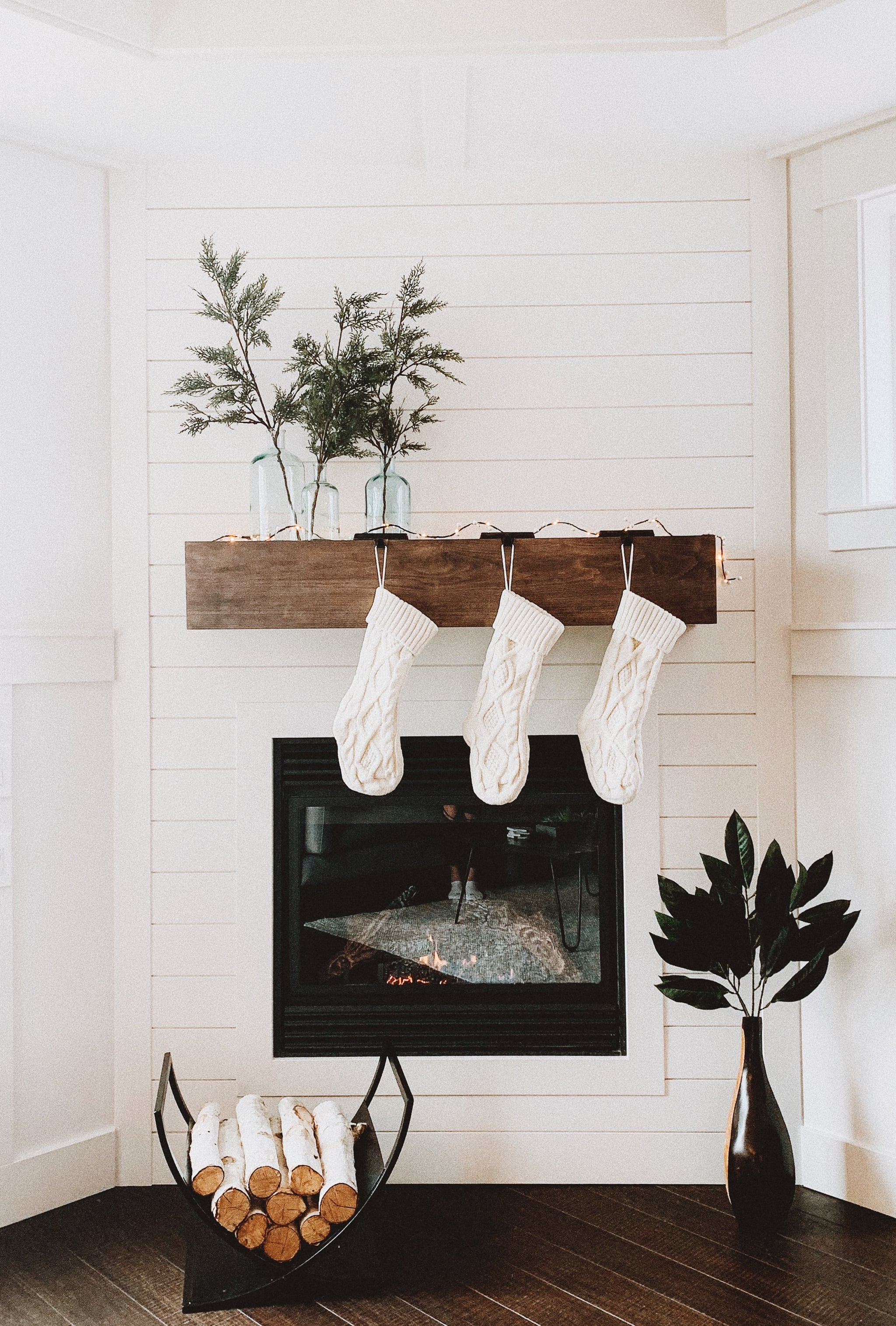 A fireplace with stockings hanging above it - White Christmas, Christmas iPhone
