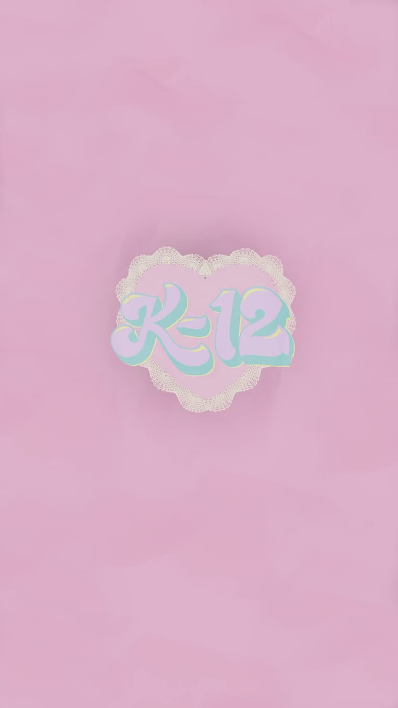 A pink background with the letters k and 12 - Melanie Martinez