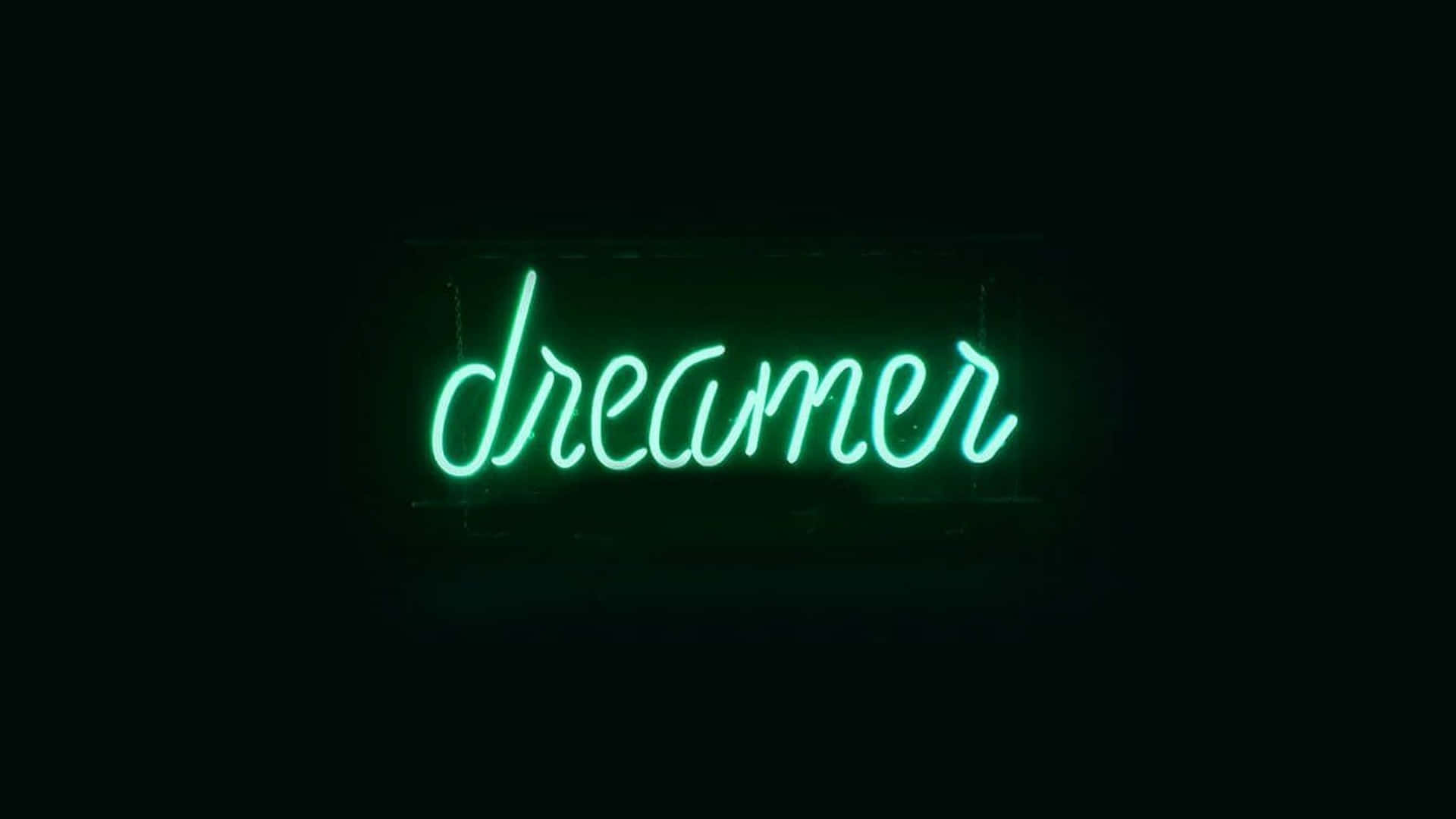 A neon sign that says dreamer - Lime green