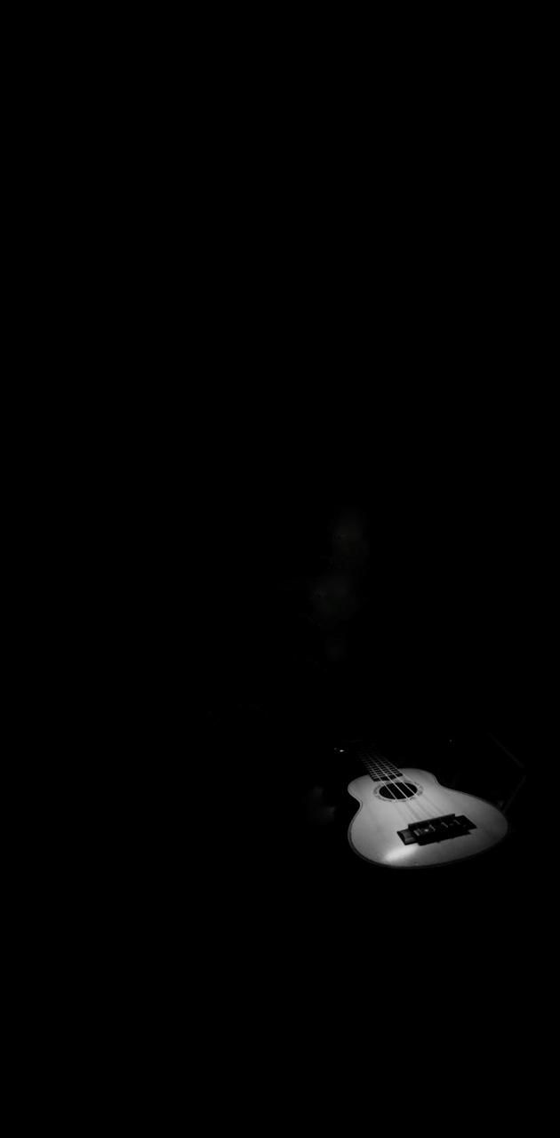 A white guitar in the darkness - Guitar