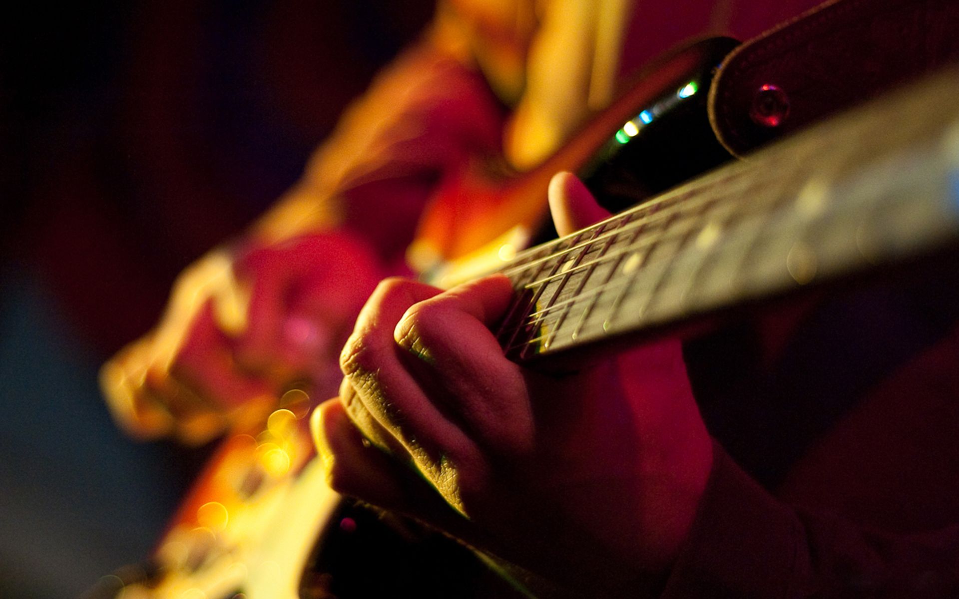 A person playing an electric guitar - Guitar