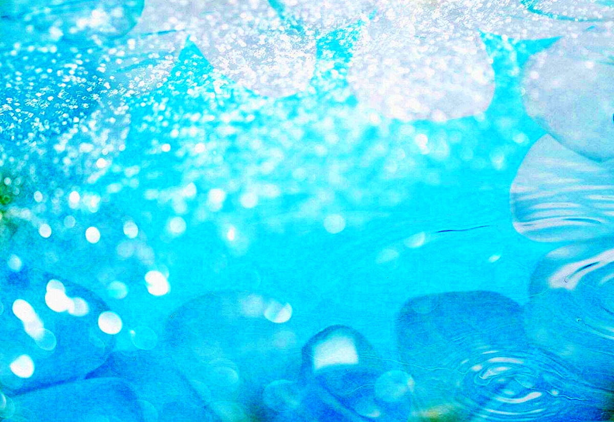 A blue background with water droplets and flowers - Aqua