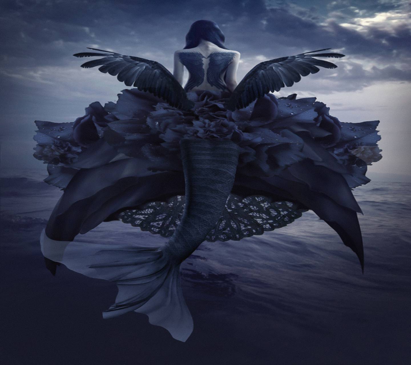 A woman sitting on top of the ocean - Mermaid