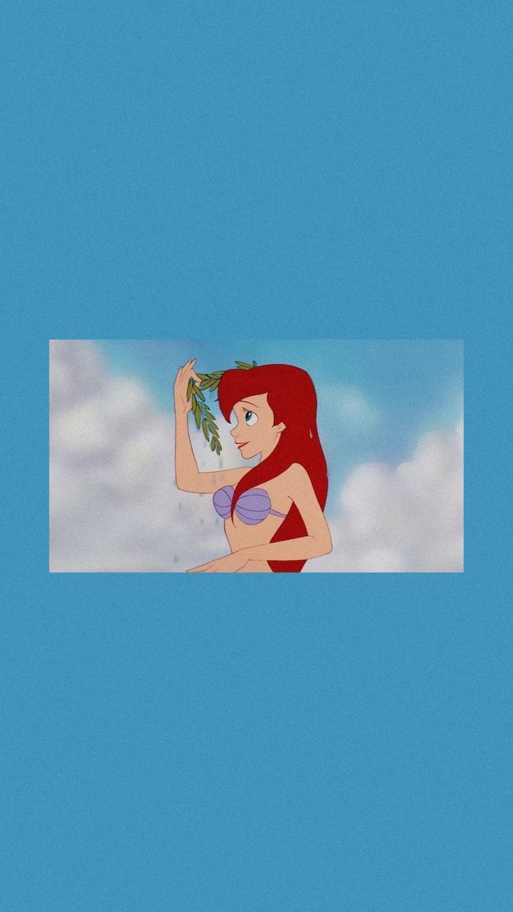 The little mermaid is holding a flower in her hand - Mermaid