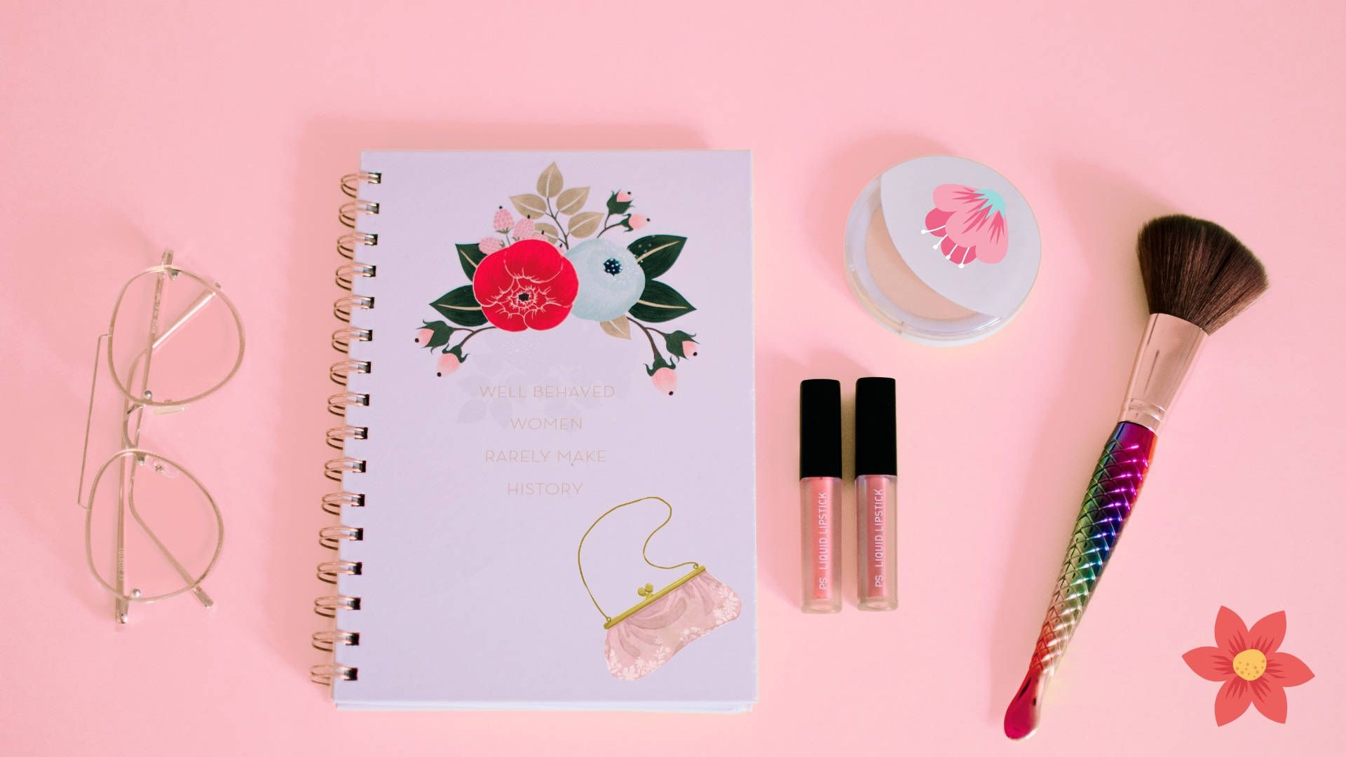 A makeup kit, notebook and other items on pink background - Makeup, flat lay