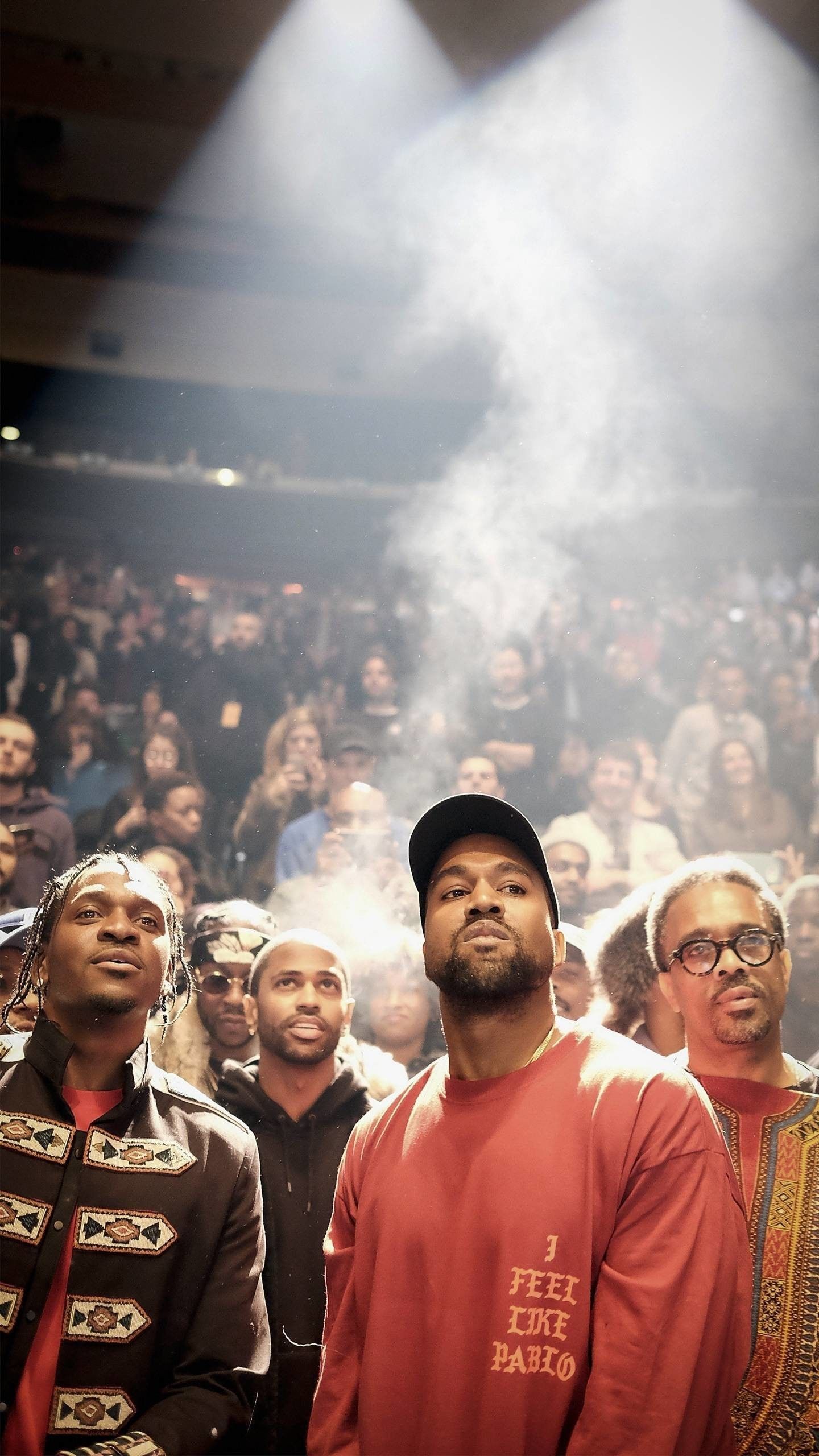 Rapper Travis Scott, center, performs with Kanye West, right, and others during a concert at the Forum in Inglewood, Calif., on Nov. 19, 2016. - Kanye West