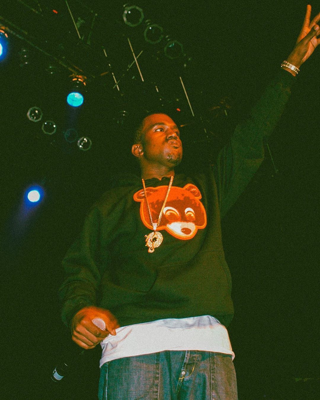 Strapped Archives on Instagram: “Kanye West photographed by Hayley Madden while performing in the United Kingdo. Kanye west wallpaper, Hip hop artwork, Kanye west