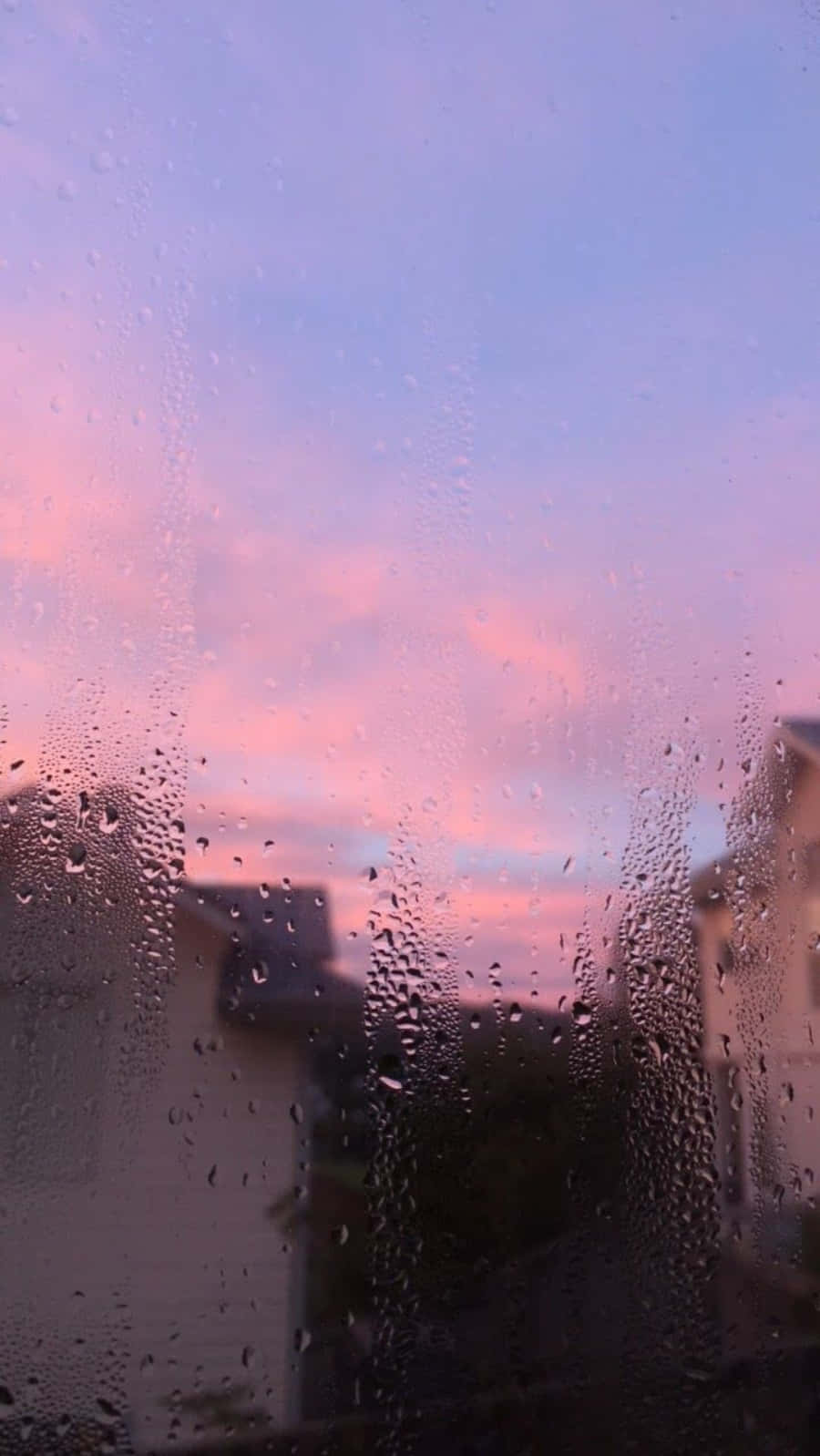 A view of the sky through rain on glass - Rain