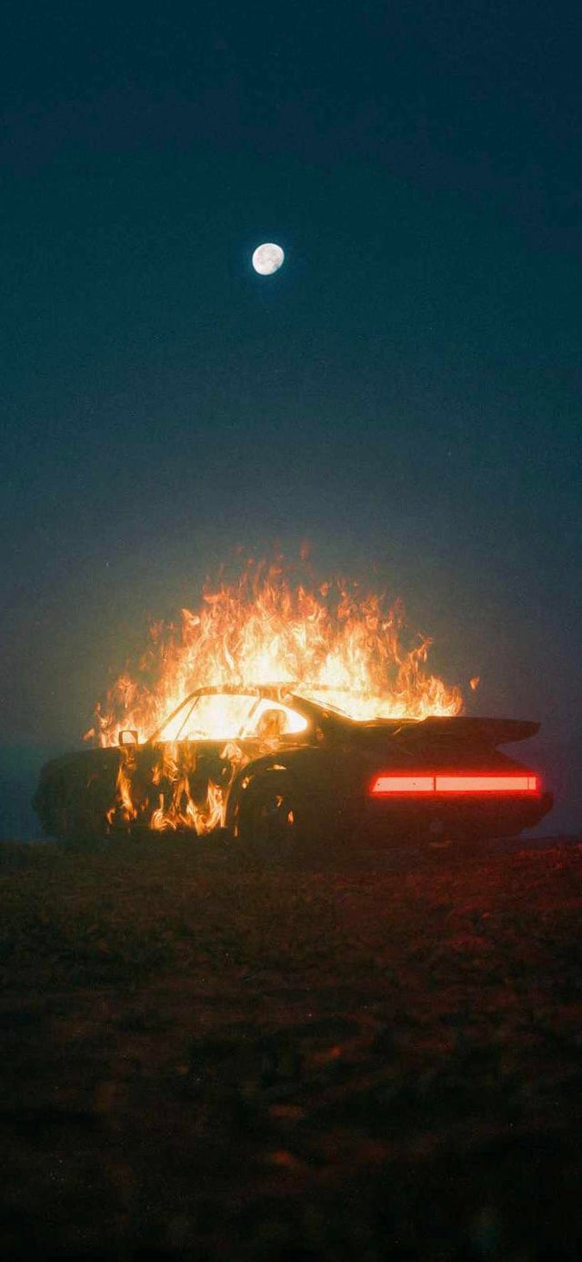 A car on fire in the middle of an empty desert - Fire
