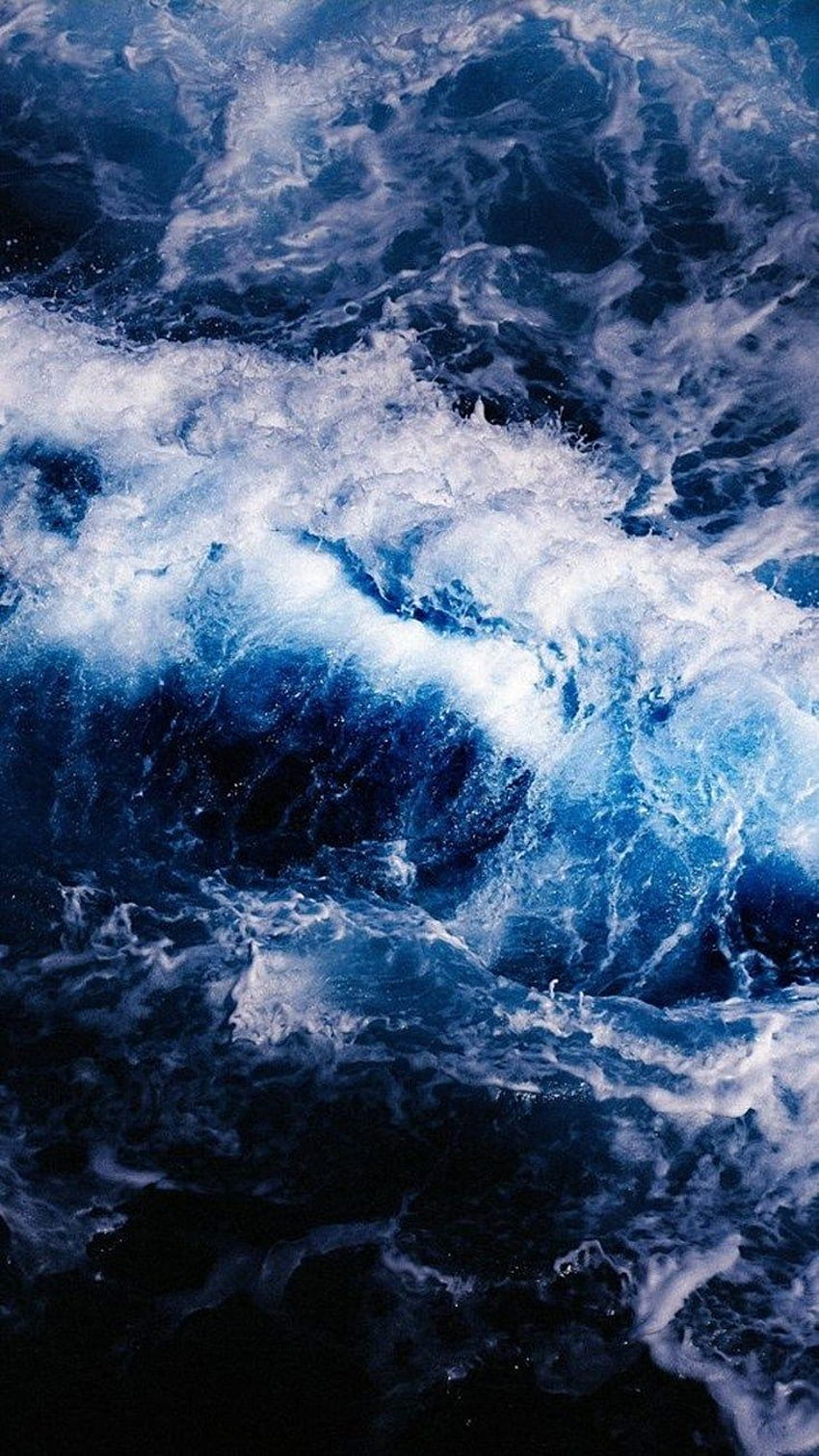 A close up of the ocean with waves - Ocean