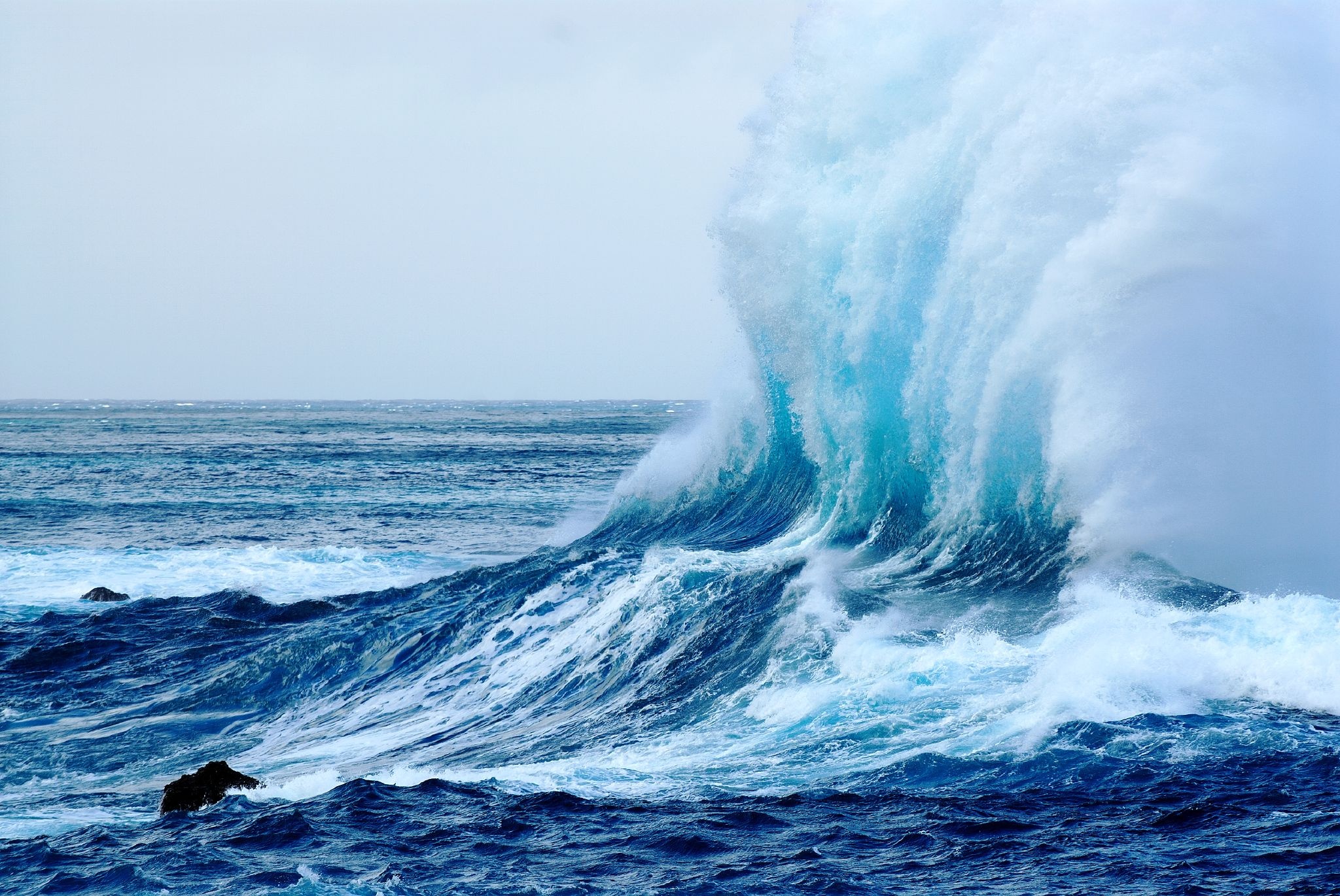 A large wave is crashing into the ocean - Ocean