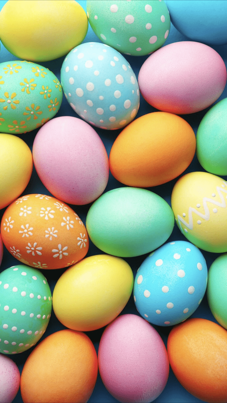 A bunch of colored easter eggs are on display - Easter