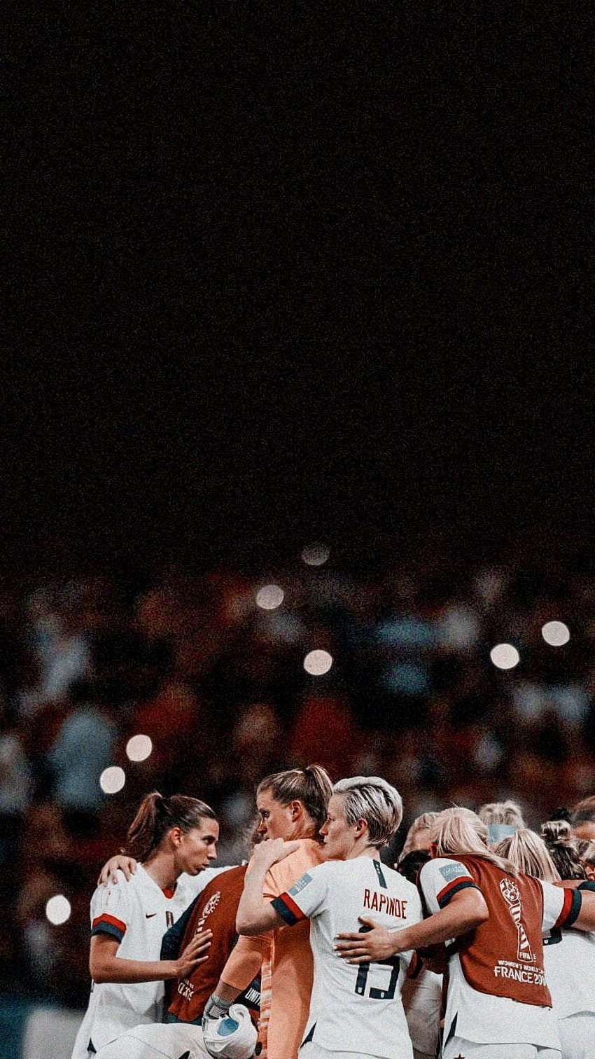 A group of women hugging each other on the field - Soccer