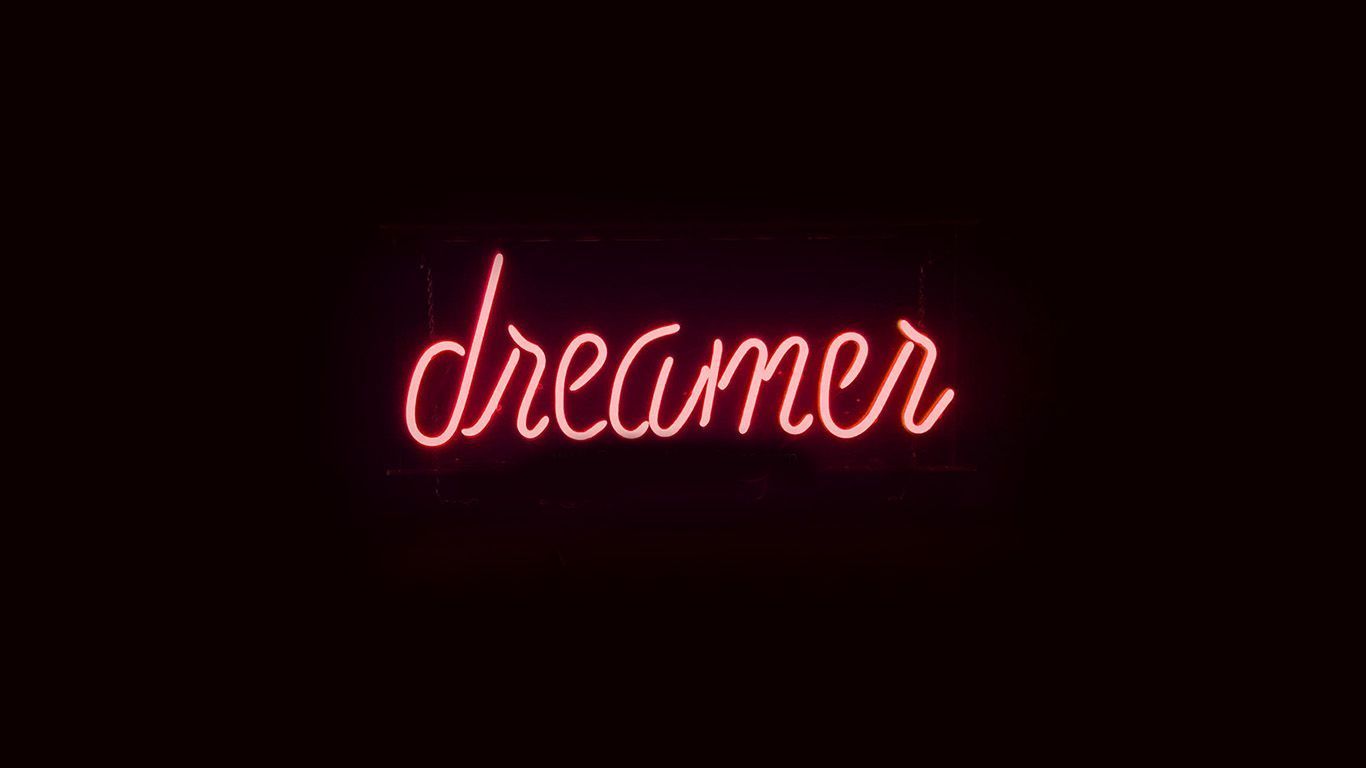 Dreamer neon sign in a dark room - 