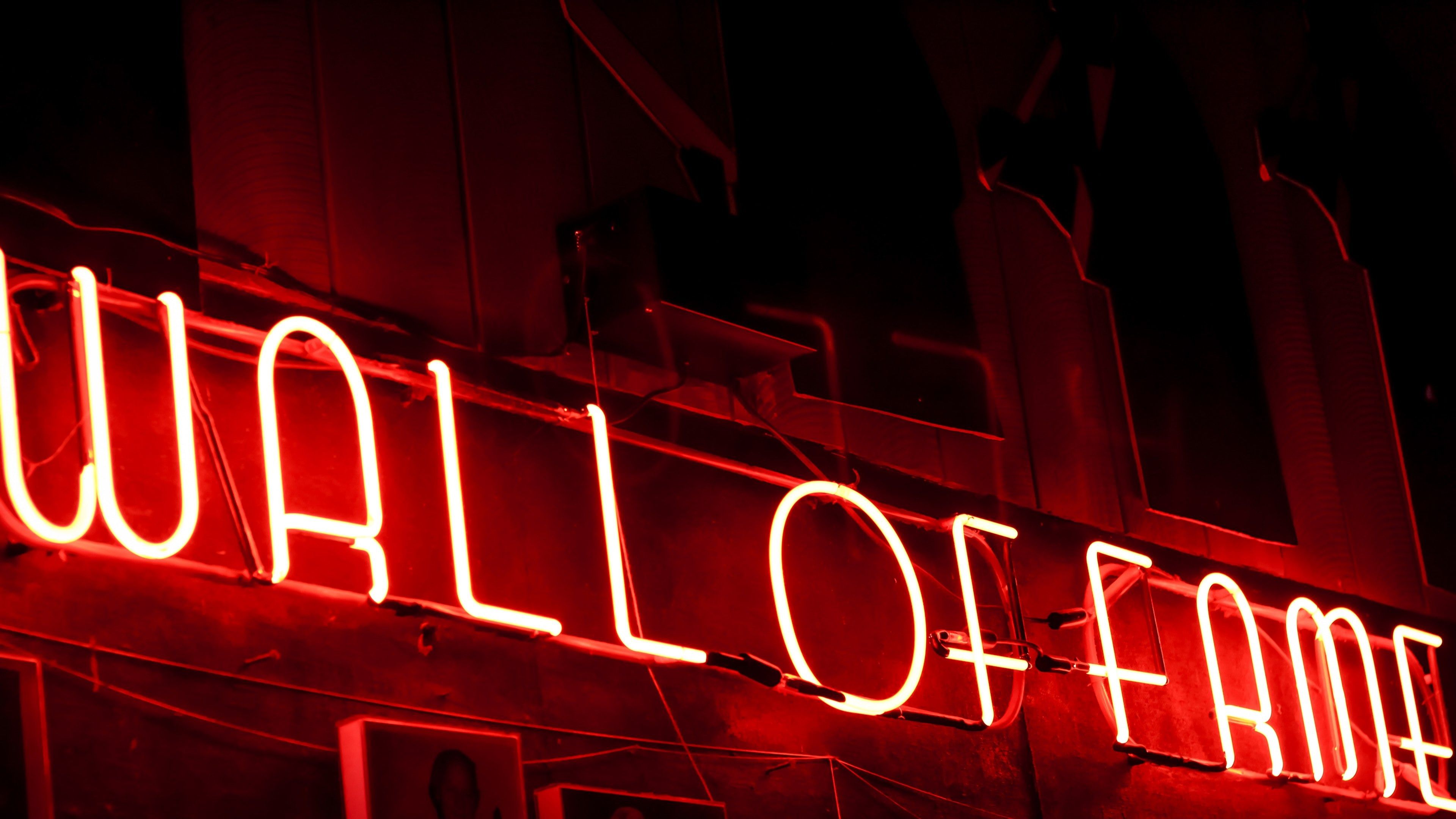 A red neon sign that says Wall of Fame. - Neon red