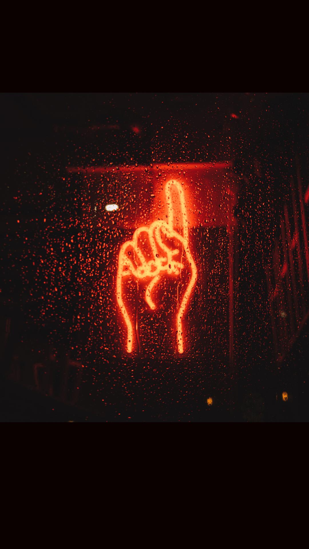 A neon sign that is lit up - Neon red