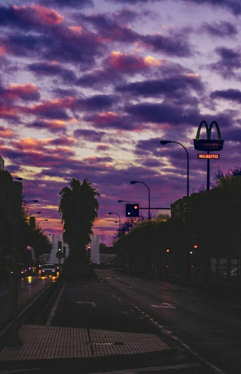 A street with a purple sky above it - Indie