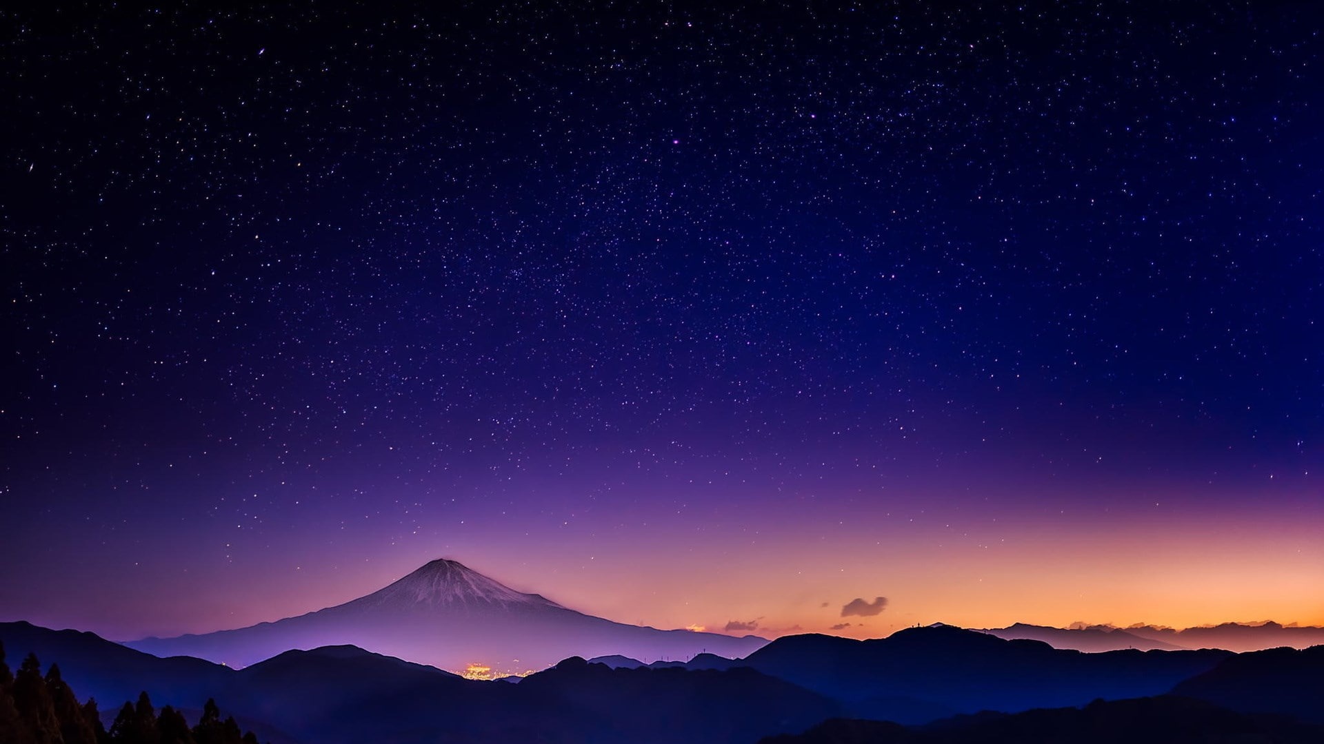 A mountain is lit up by the stars - Nature