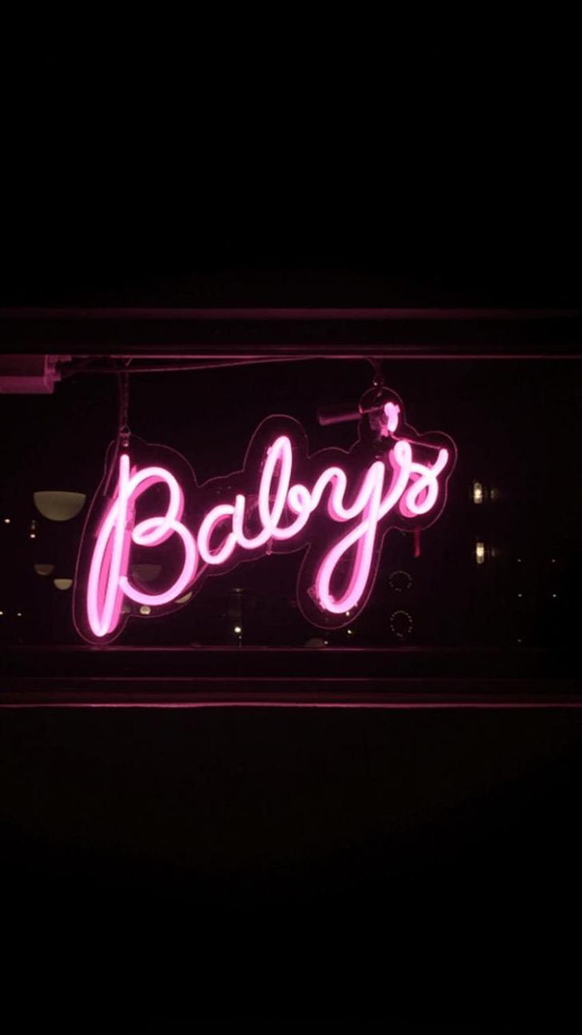 A neon sign in pink that says Babys - Neon pink