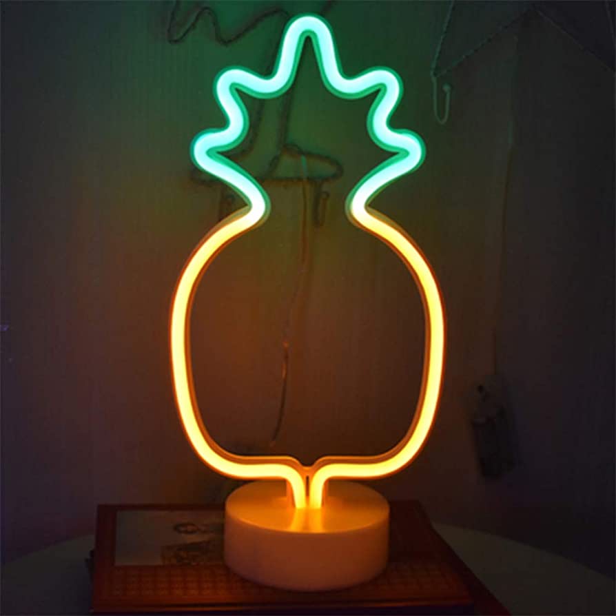 A neon pineapple lamp on top of the table - Neon orange