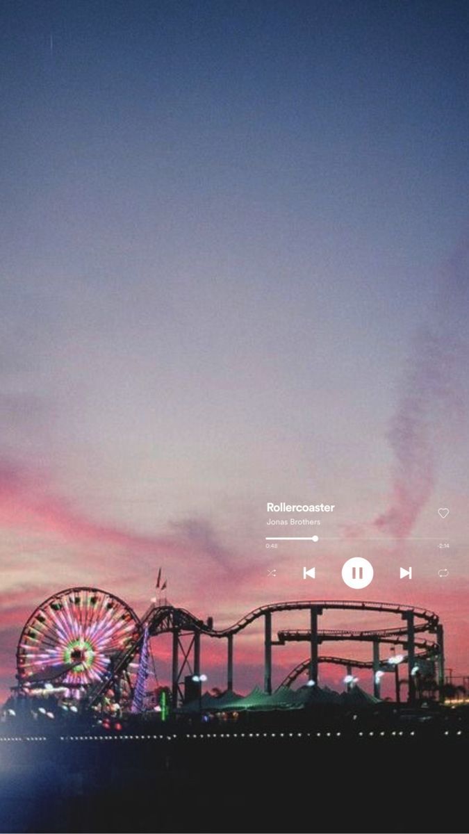 Aesthetic background of a rollercoaster and a ferris wheel at sunset - Spotify