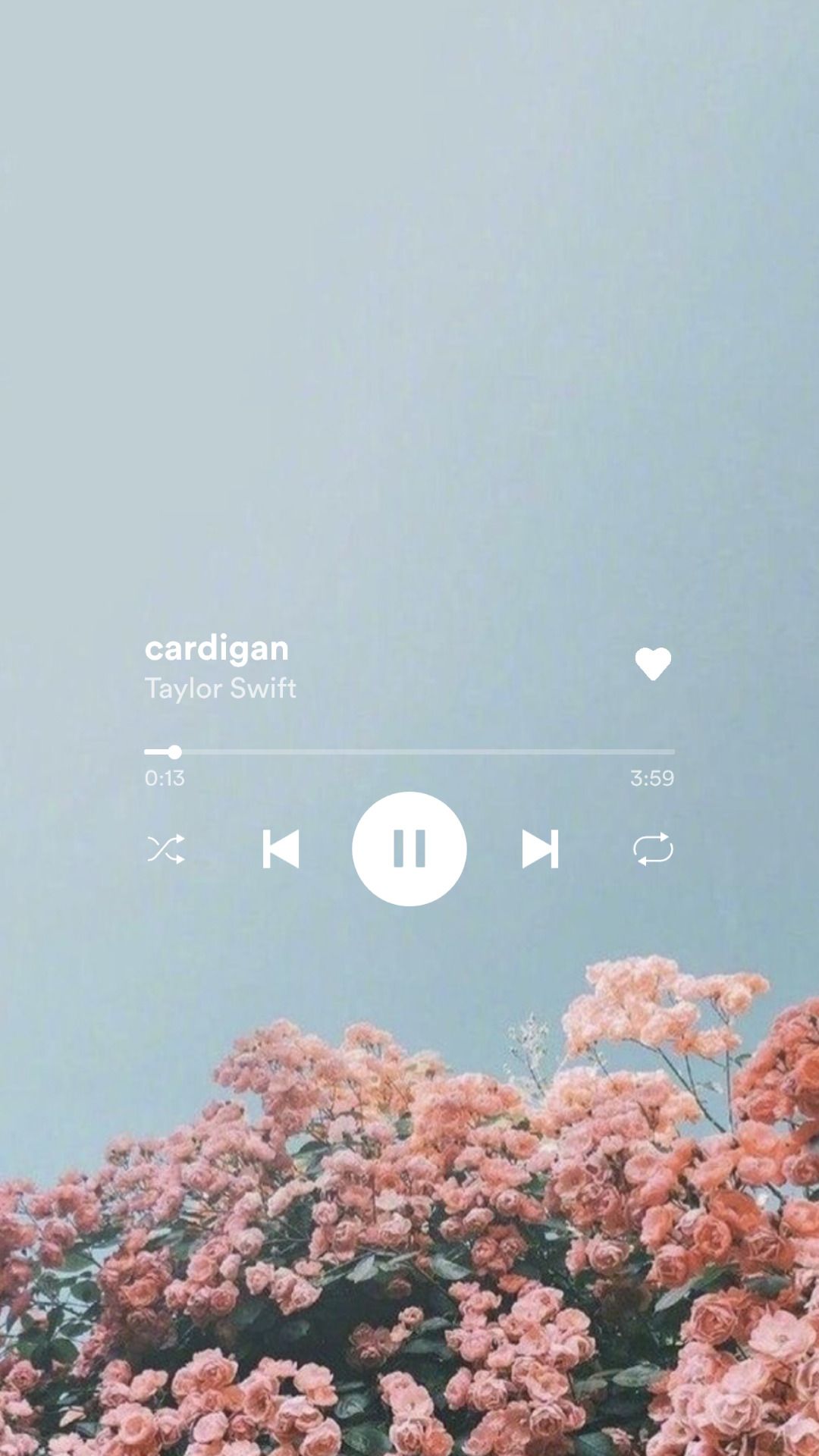 A phone screen displays the music player for Taylor Swift's 