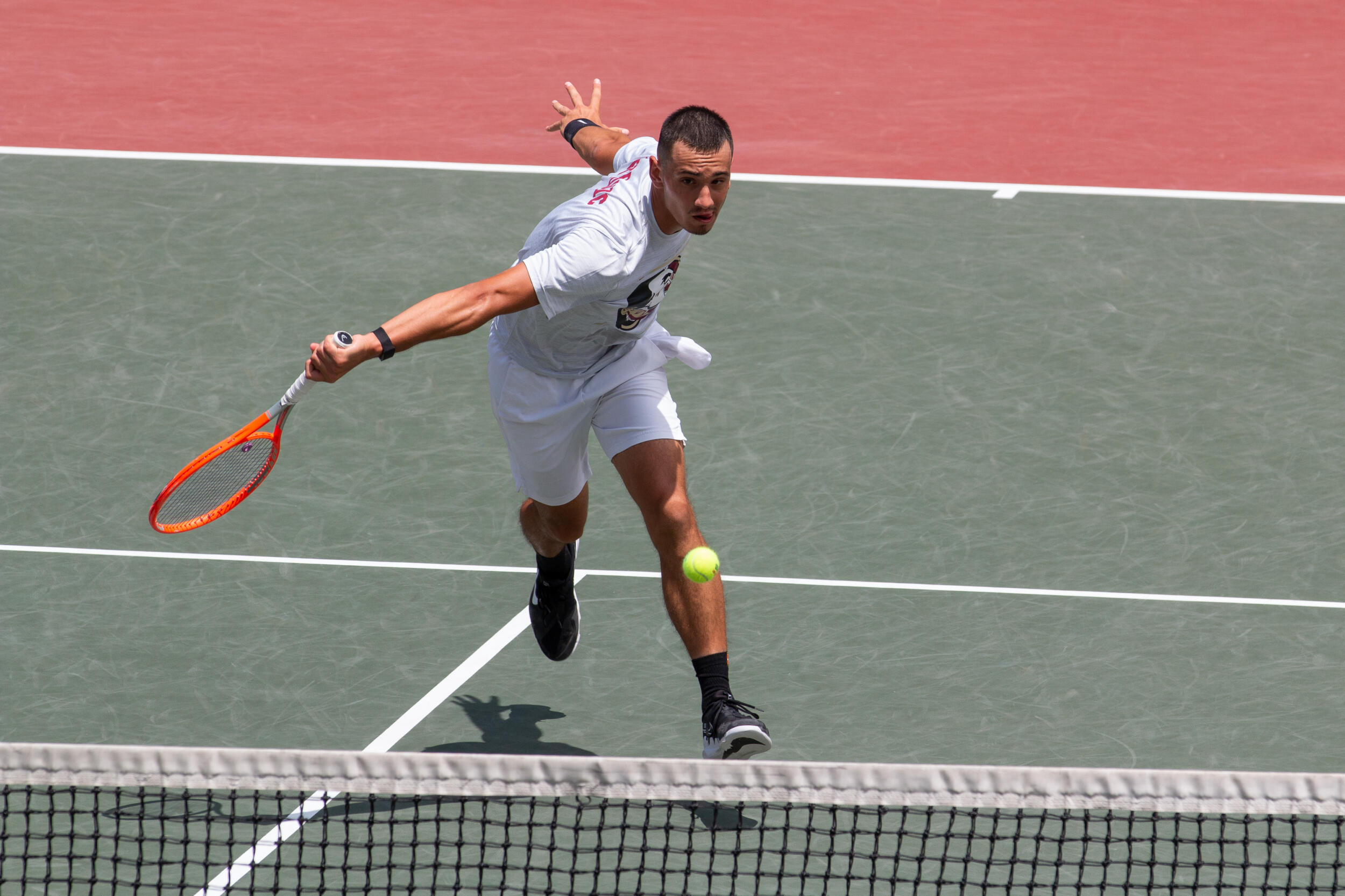 A man is playing tennis on the court - Tennis