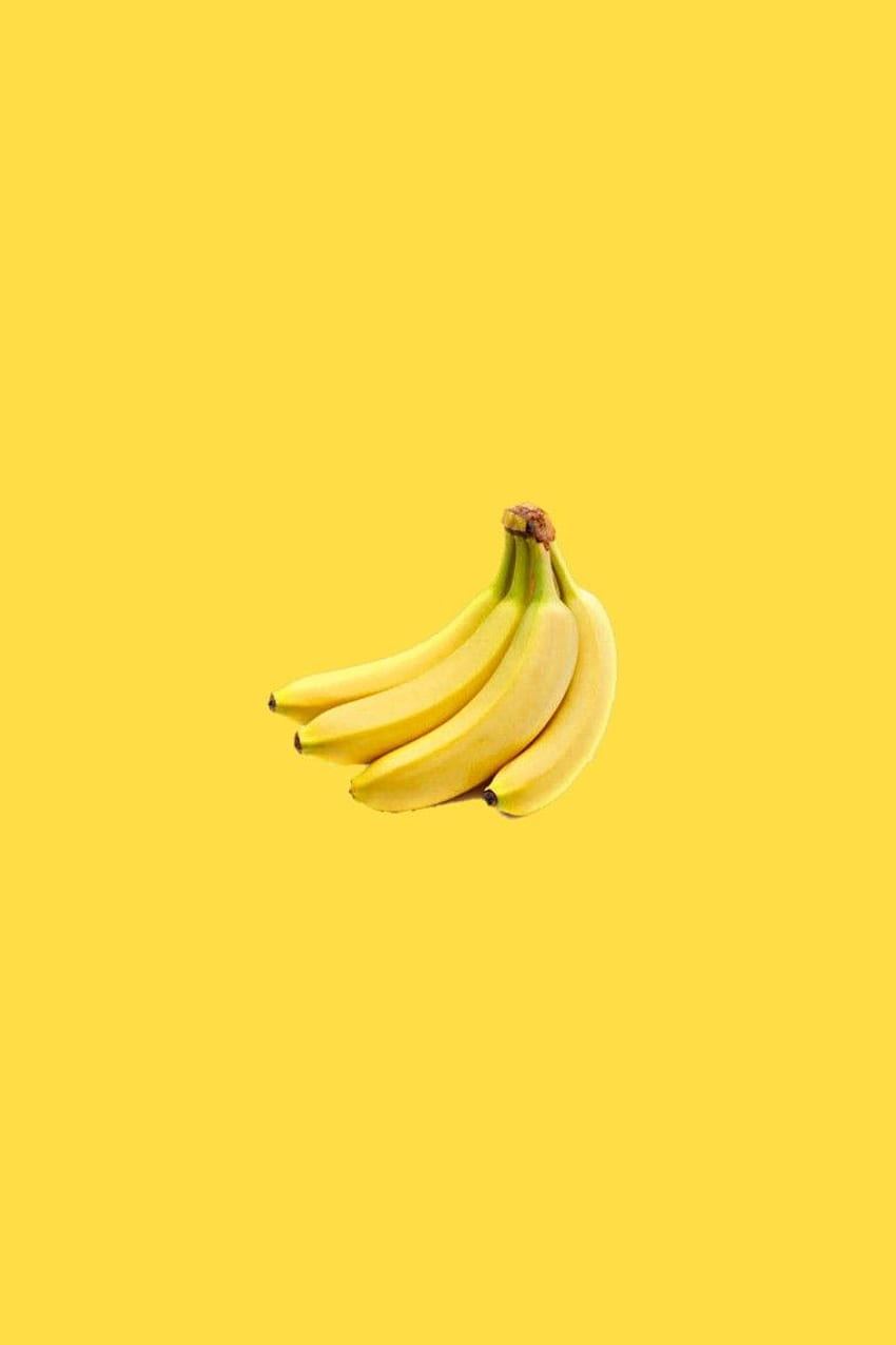 A bunch of bananas on a yellow background - Banana