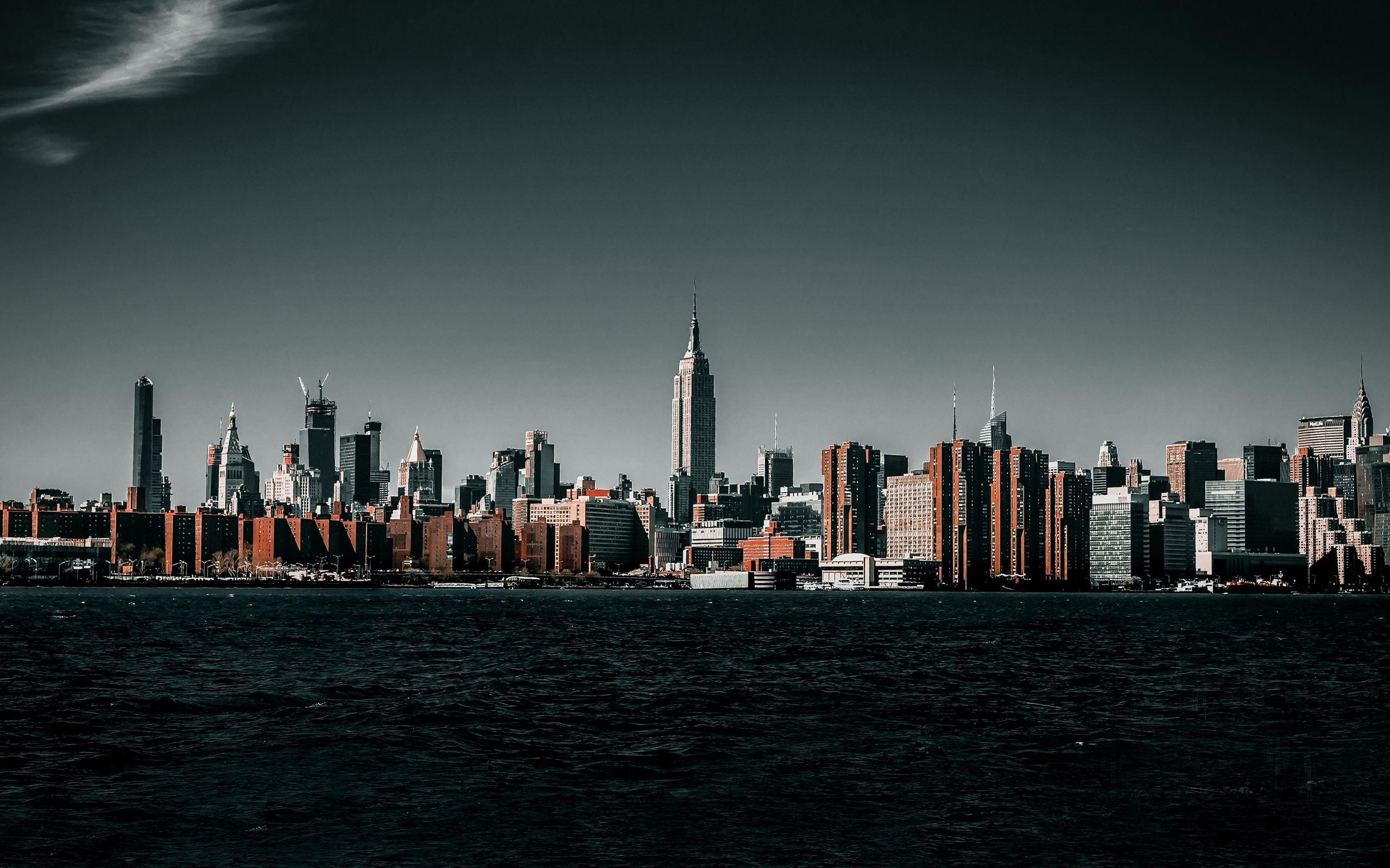 A city skyline with buildings and water - IMac, 2560x1600