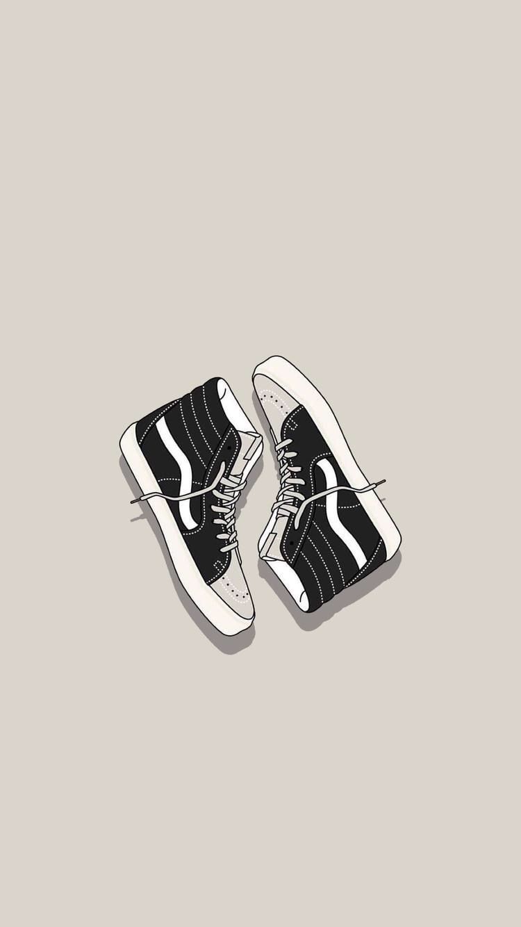 A pair of black and white sneakers - Vans