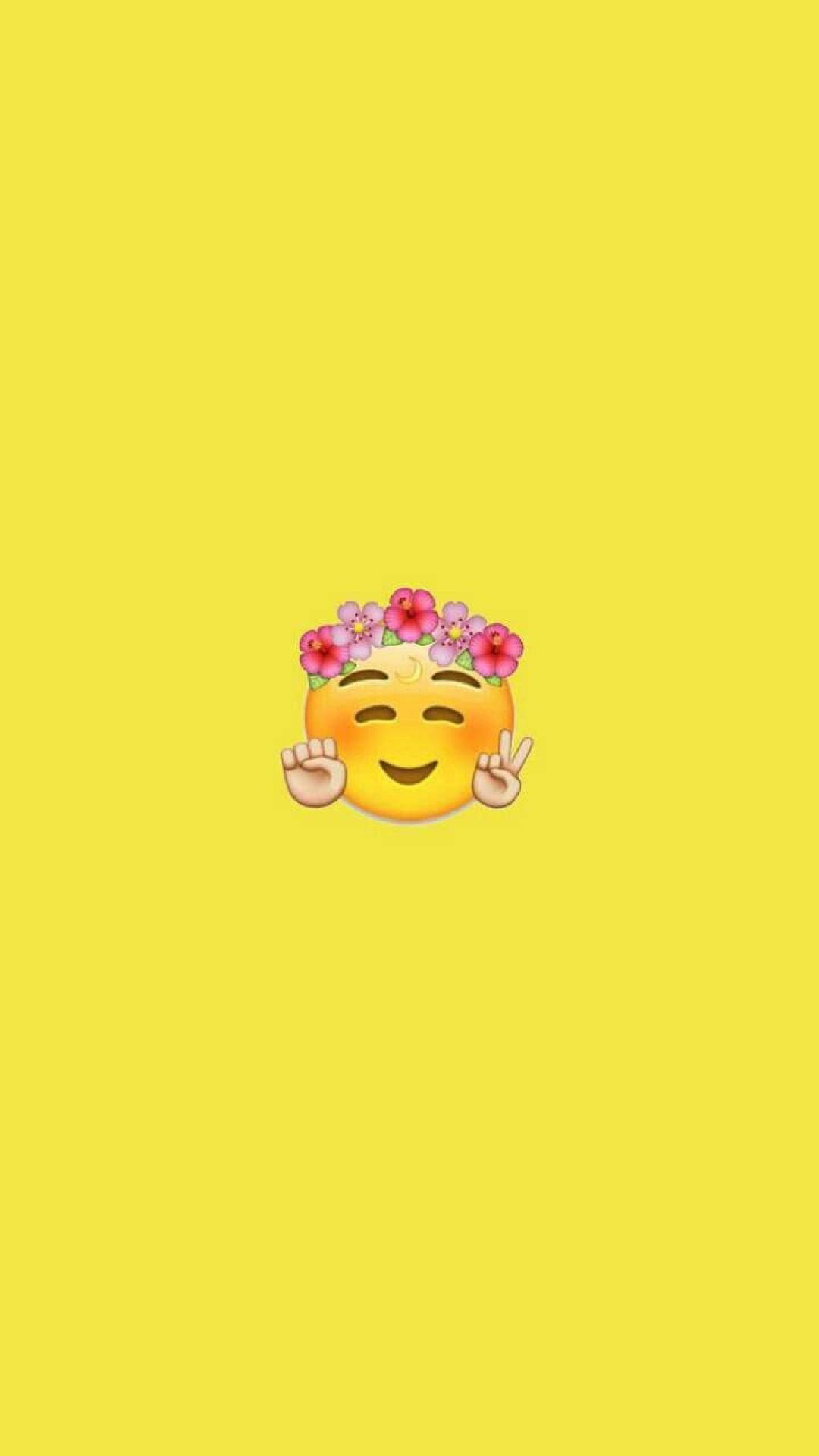 A yellow background with an emoji wearing flowers - Emoji
