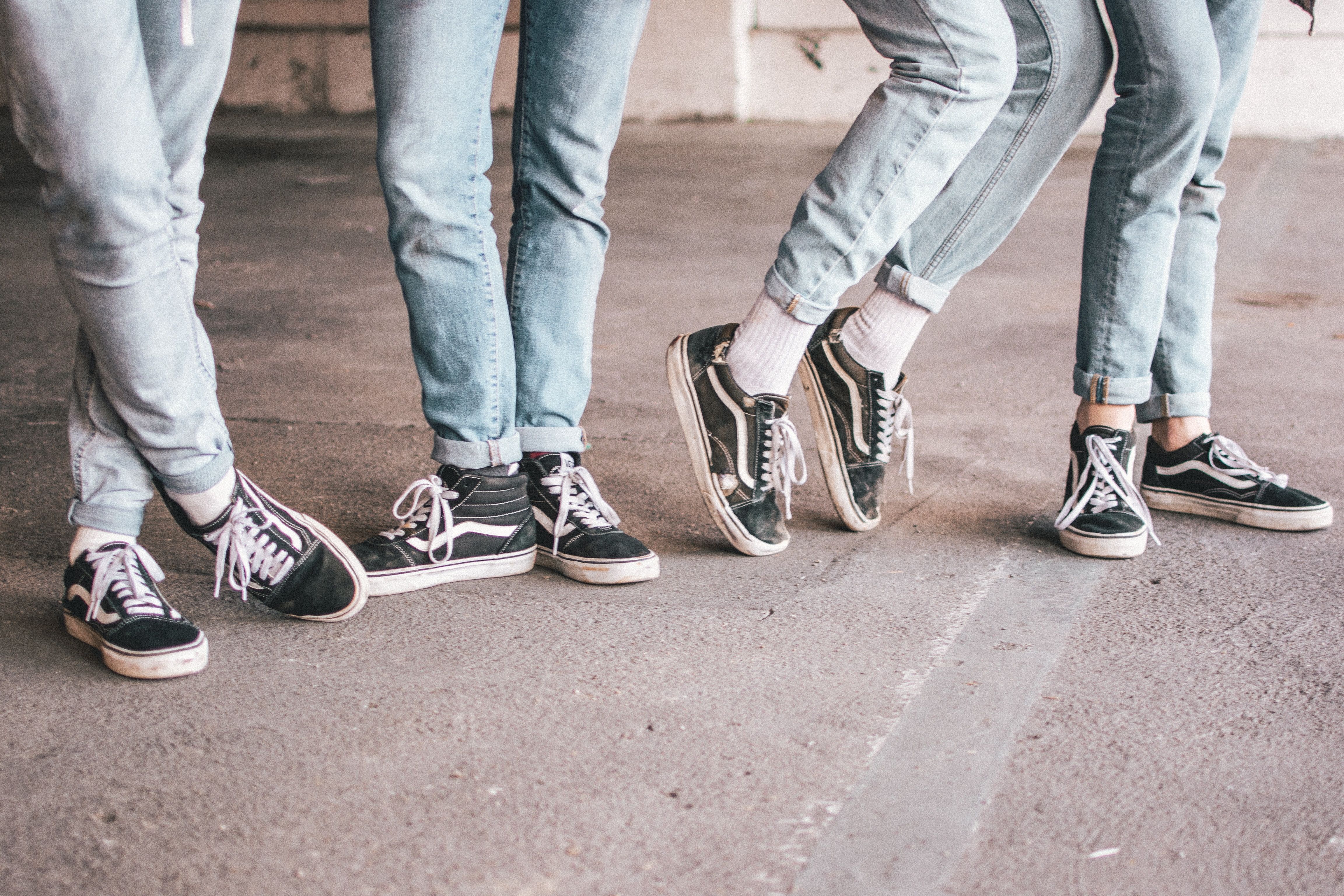 A group of people standing on the ground - Vans