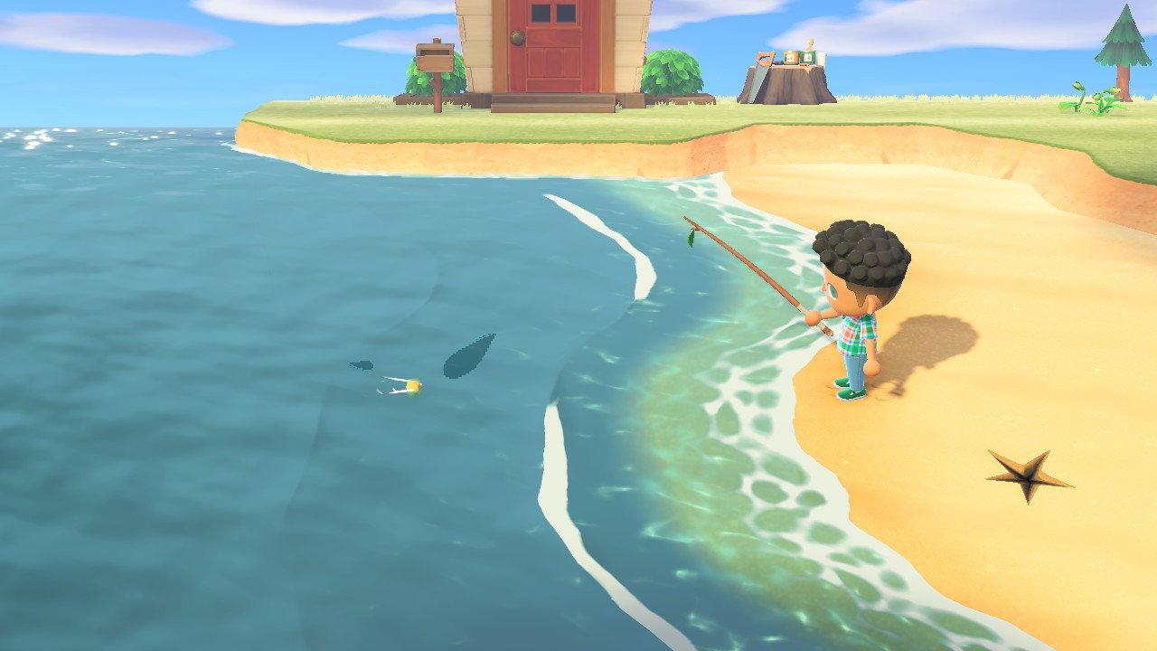 A character in Animal Crossing: New Horizons stands on a beach with a fishing rod. - Animal Crossing