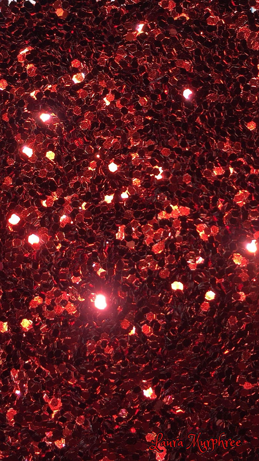 A close up of red glitter on the ground - Light red
