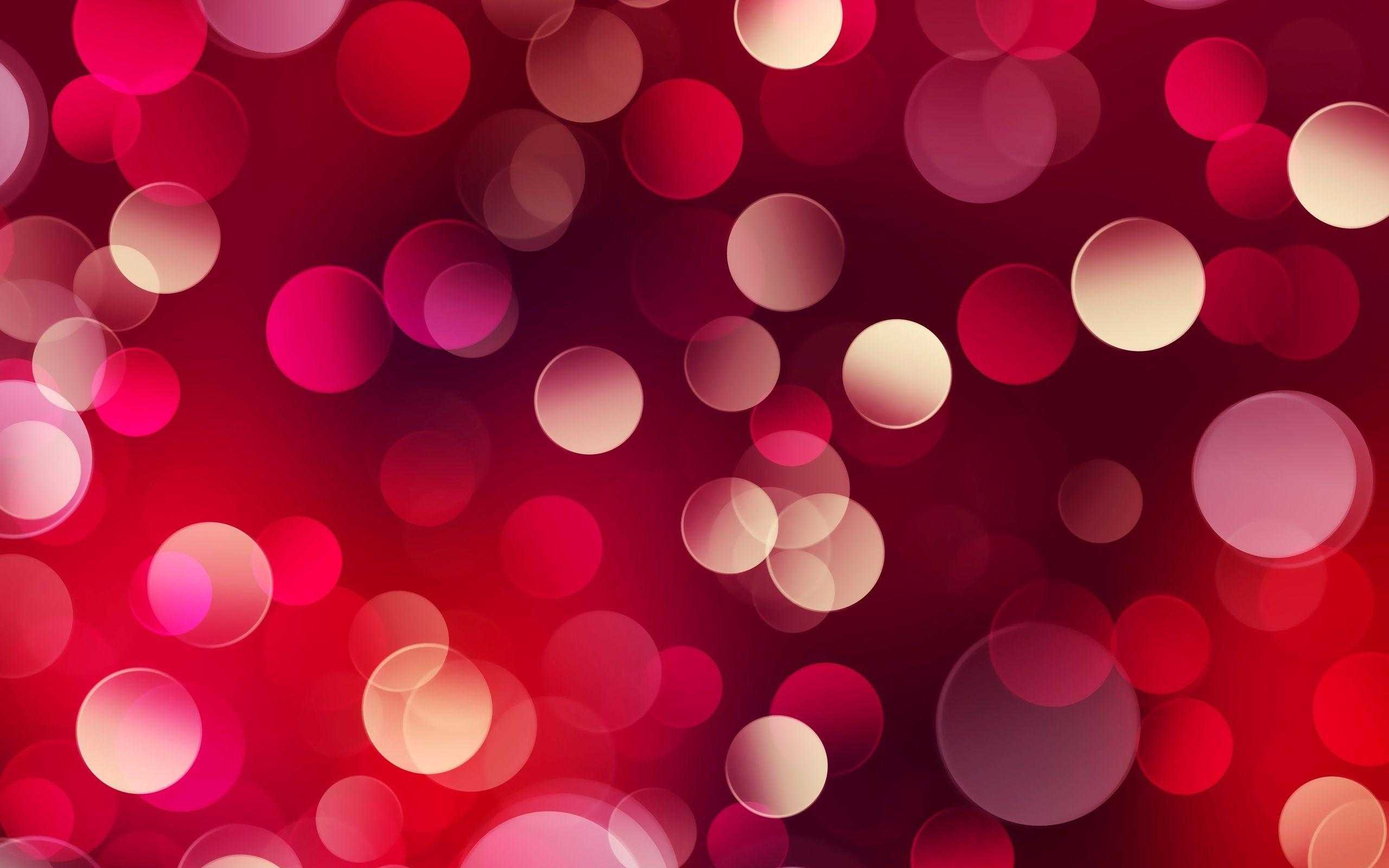 A collection of red and pink bokeh lights on a red background - Light red