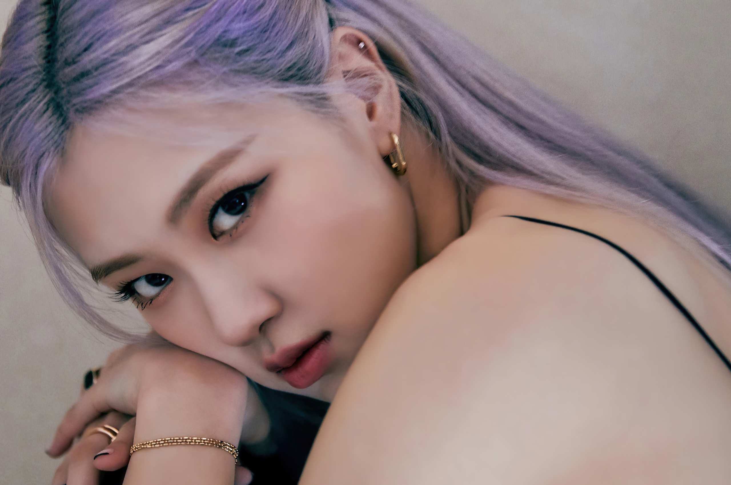 A woman with purple hair is posing for the camera - BLACKPINK