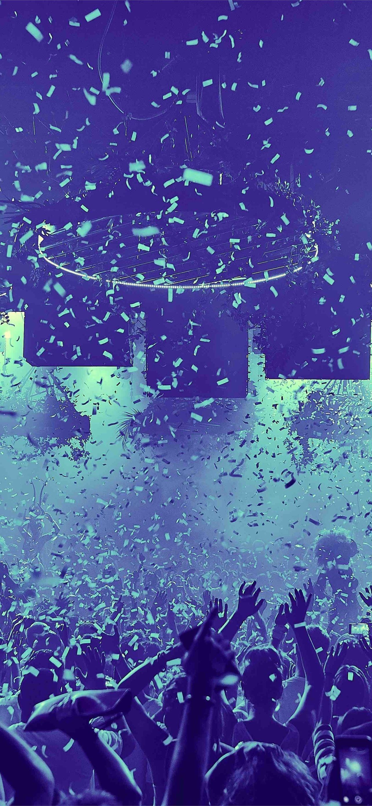 Confetti falling from the ceiling at a concert - Indigo