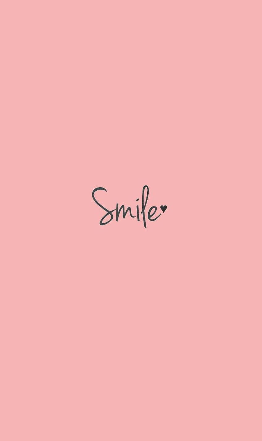 The word smile is written on a pink background - Positivity